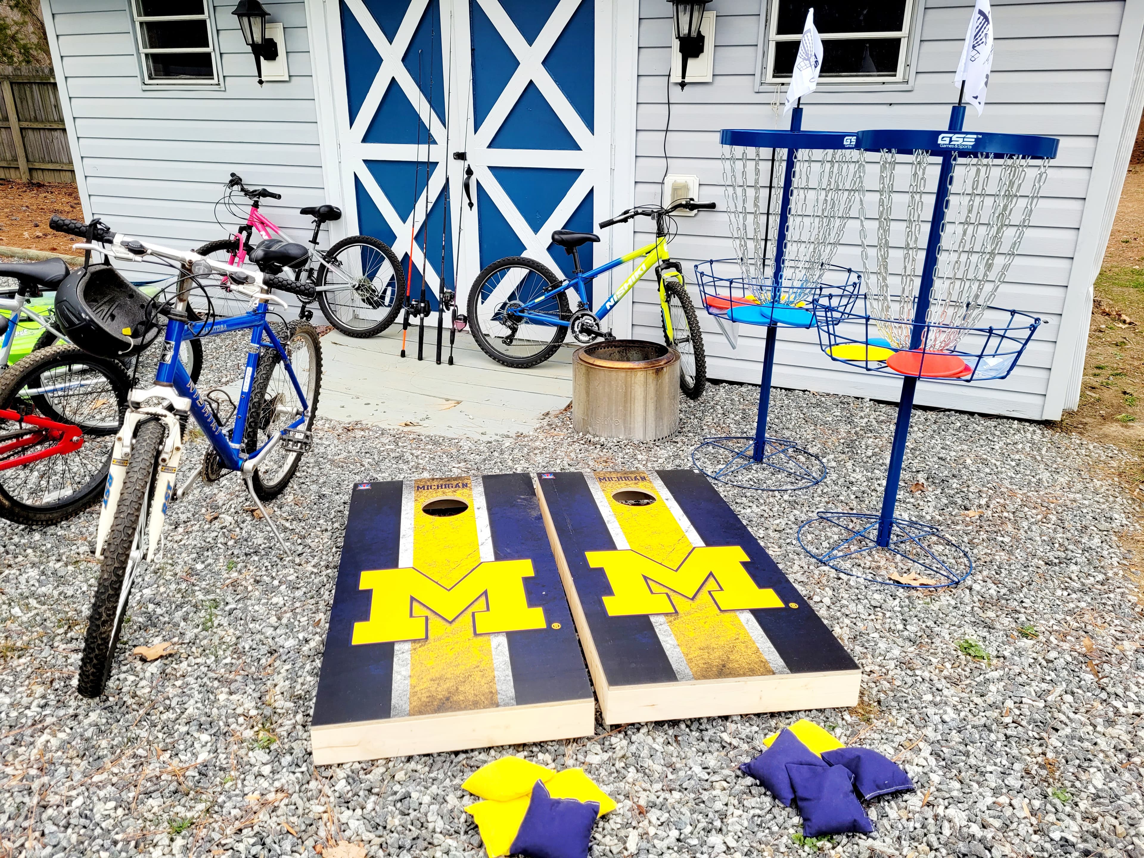 2 Frisbee golf baskets, solo stove and cornhole