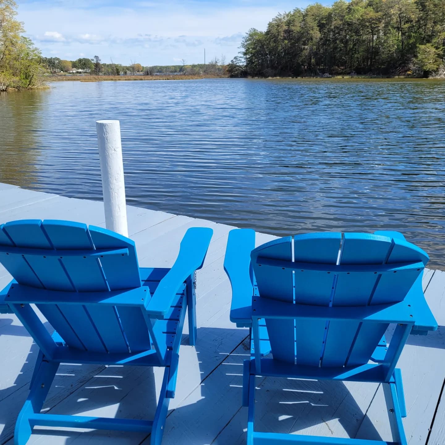 Adirondack chairs on the pier for fishing or relaxing