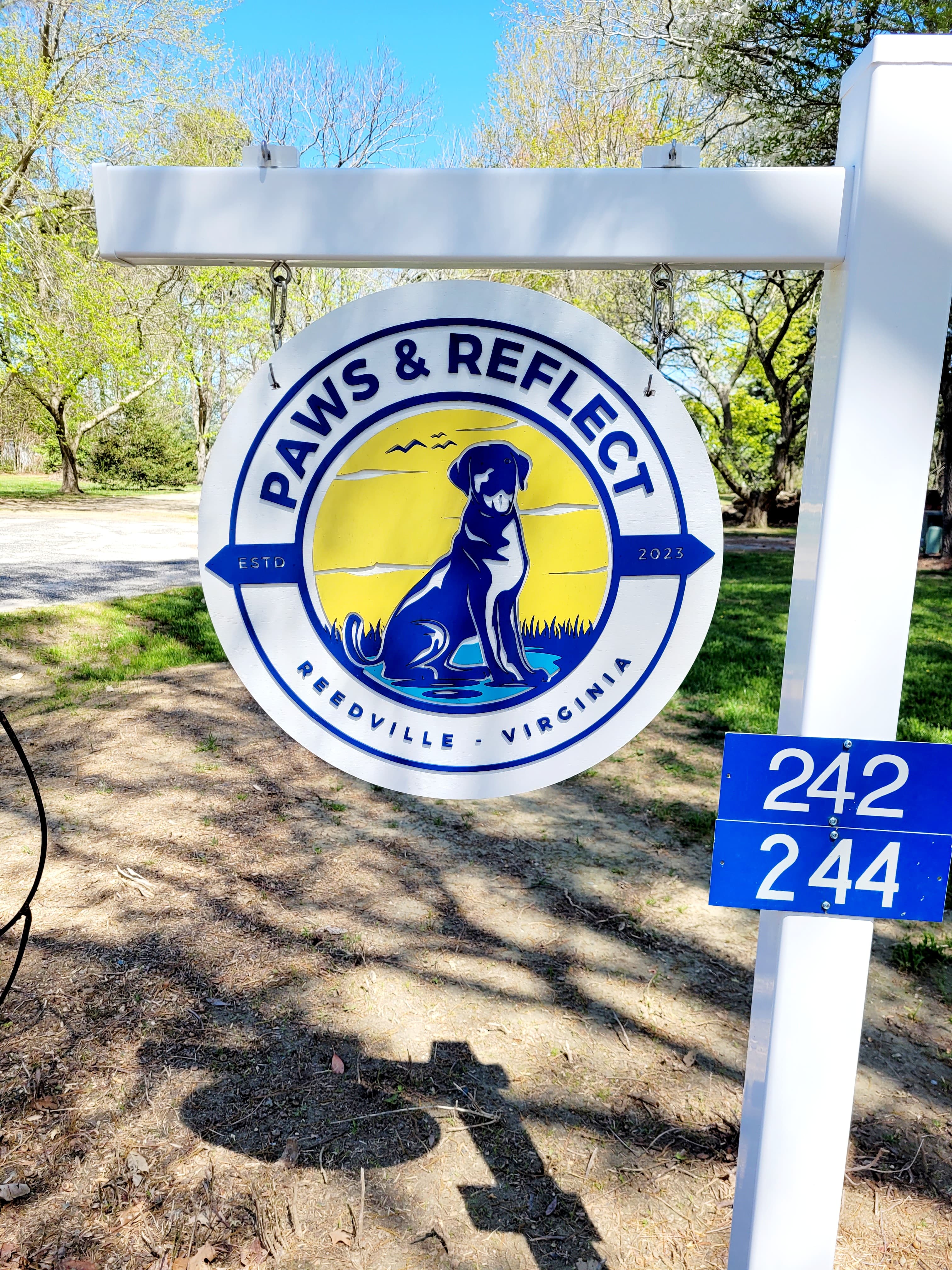 Paws & Reflect sign