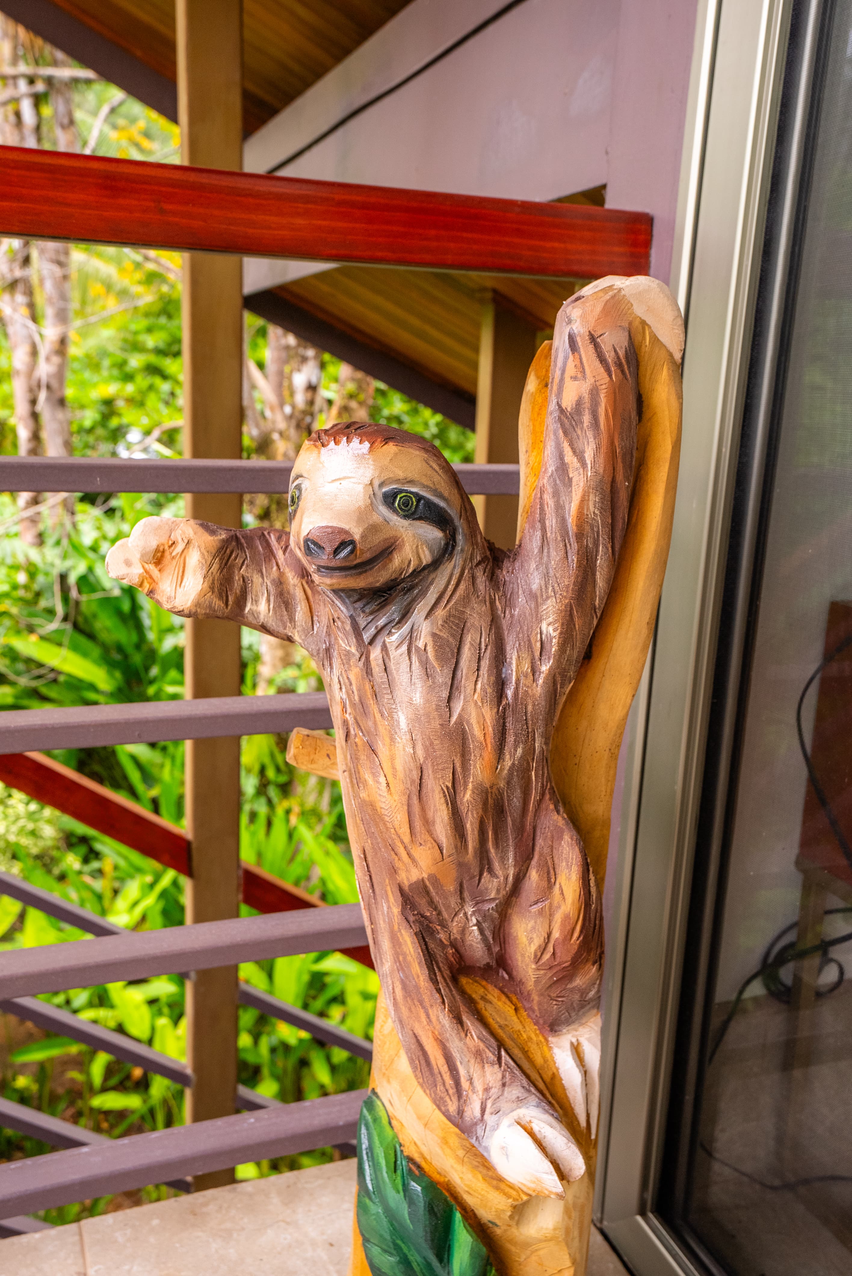 Slothy wooden carving welcomes you to Sloth Villa