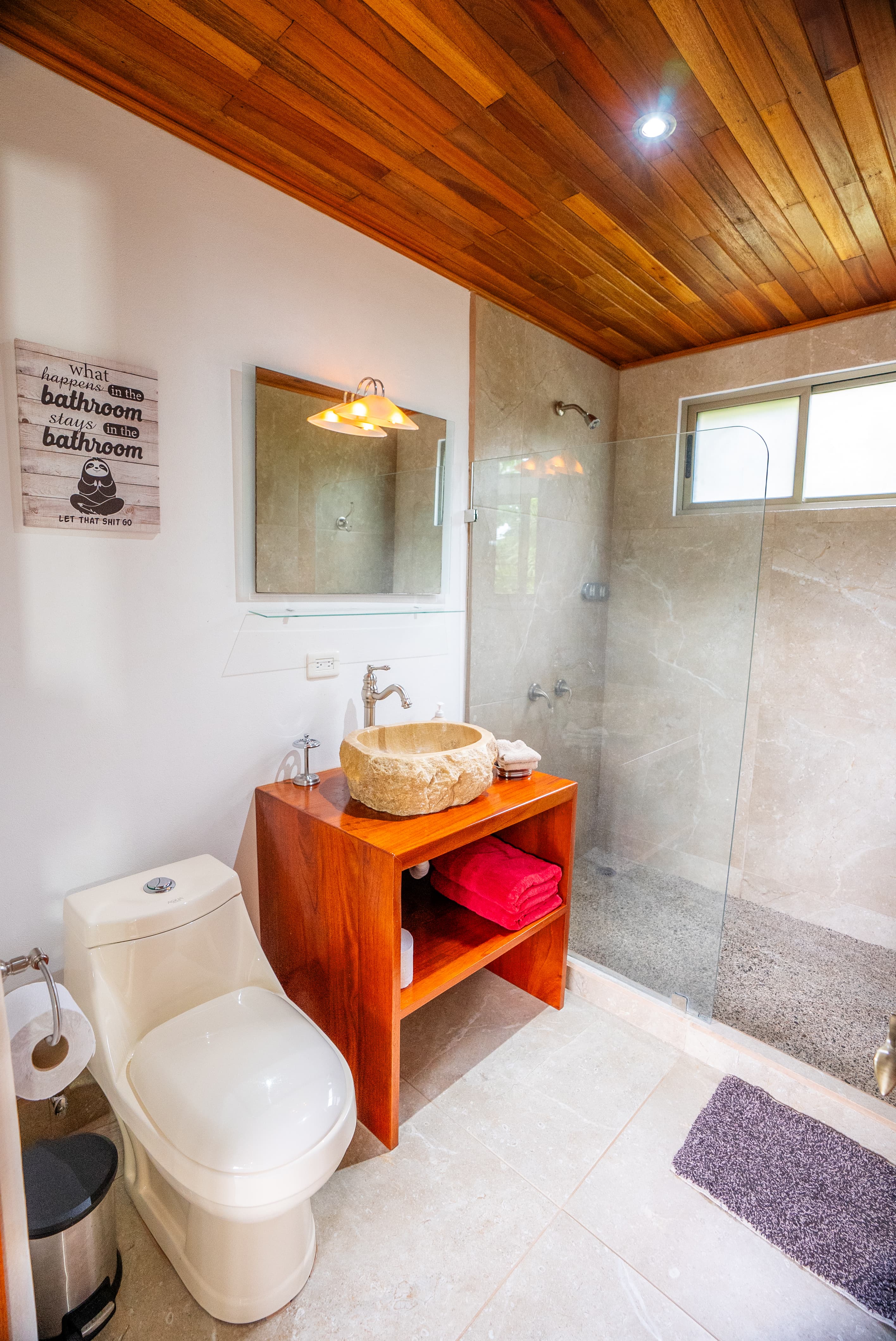 Bathroom with granite sink and powerful shower