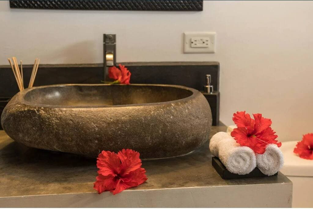 Beautiful granite sink in the private bathroom.  