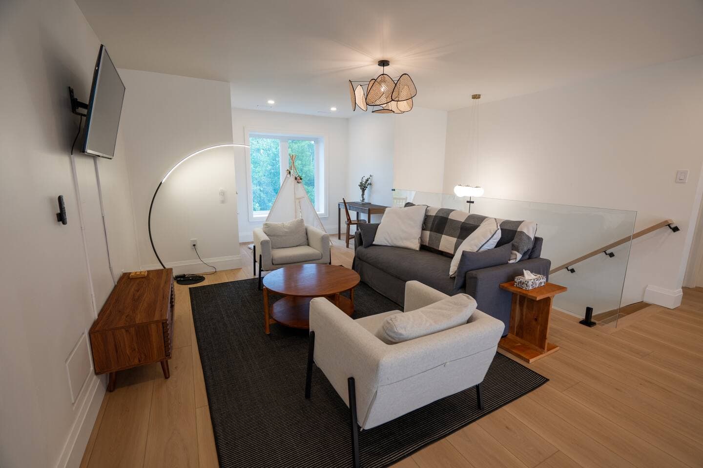 Loft area that offers queen pull-out, dedicated desk and tee-pee for children's area.