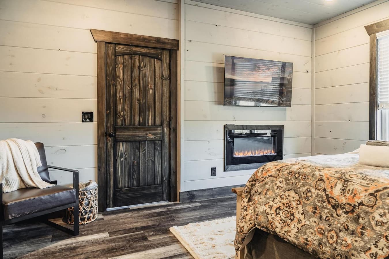 Master Bedroom (Main Floor) with a cozy fireplace