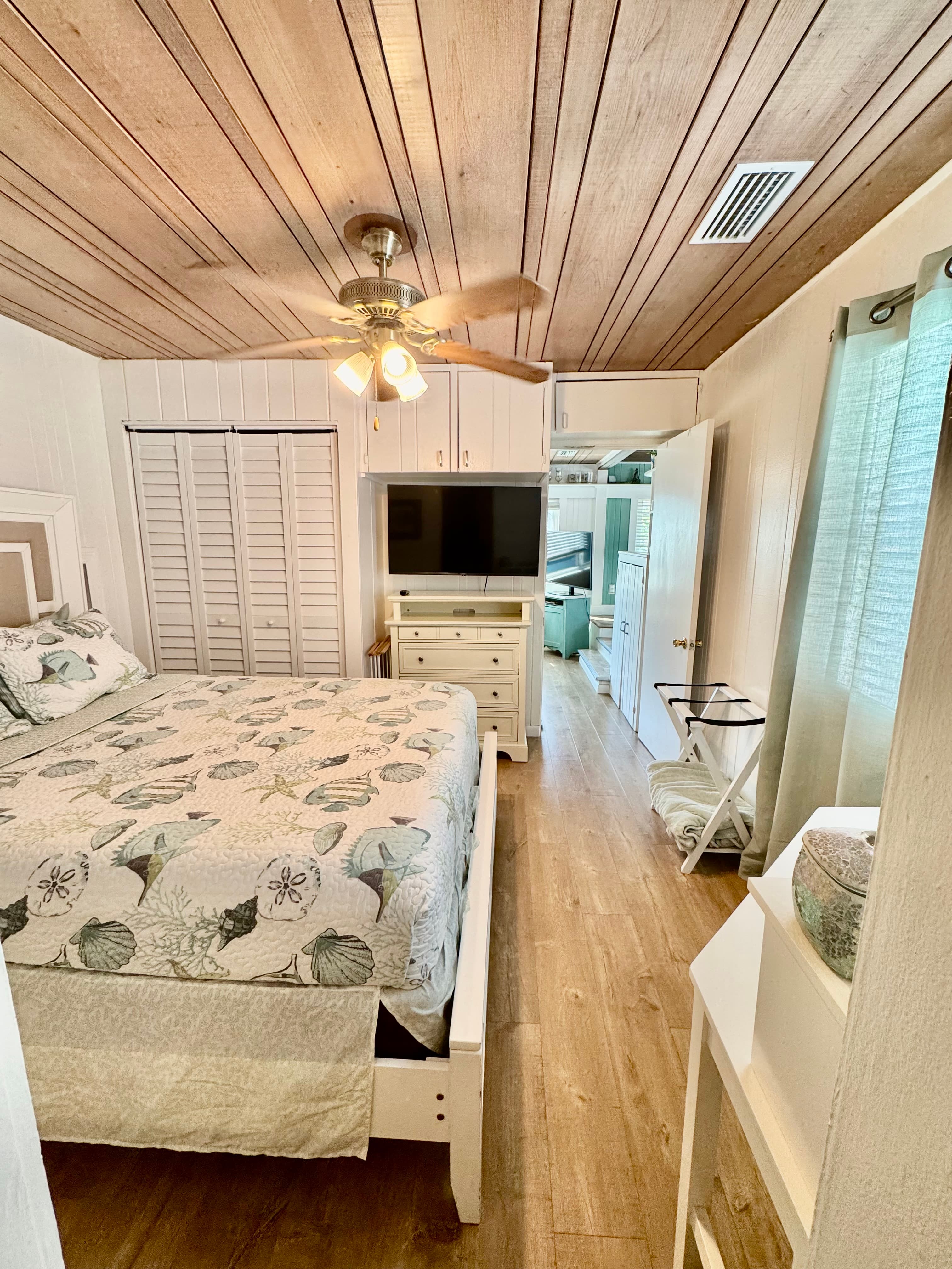 Bedroom with closet and smart TV