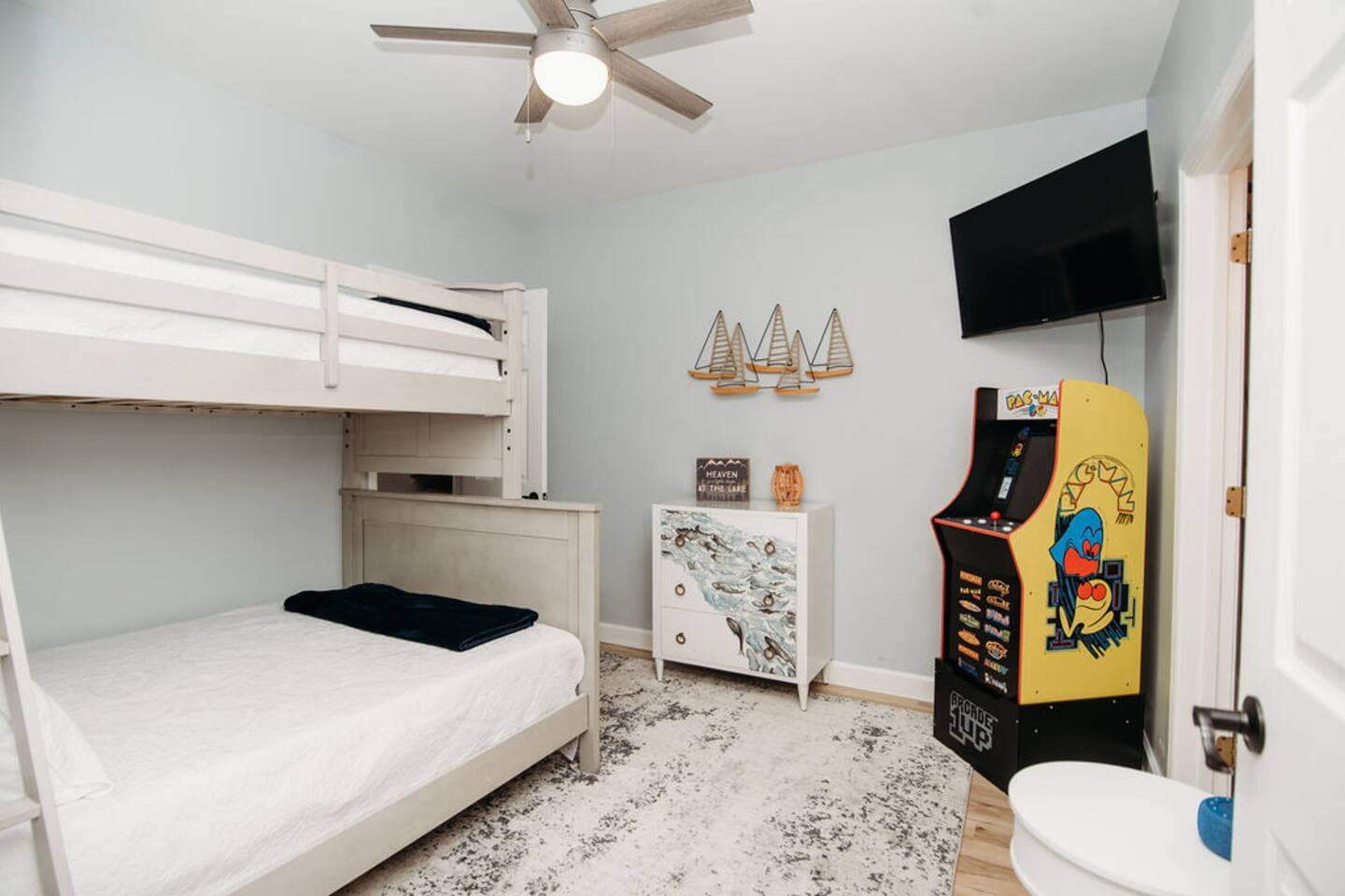 Kids (and kids at heart) will love this bedroom with a cozy bunk bed, smart TV, retro arcade game—perfect for winding down or playing all day! Also features a private full bathroom with a shower/tub combo, making it super convenient for families.

