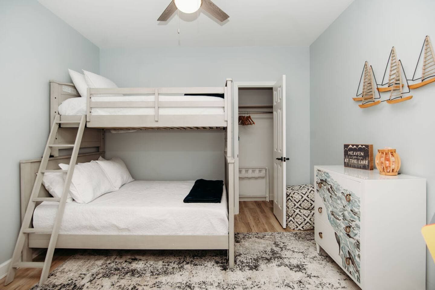 Perfect for kids or a group, this bedroom features a twin-over-full bunk bed, nautical-themed décor, and its own closet space—fun, functional, and ready for a great night's sleep.

