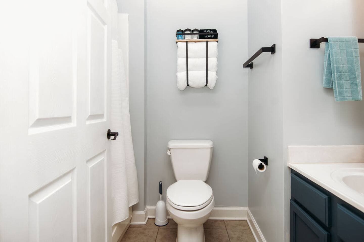 Bright and clean full bathroom featuring a combination shower/tub, fresh towels, and essential toiletries—perfect for refreshing after a day of adventure.

