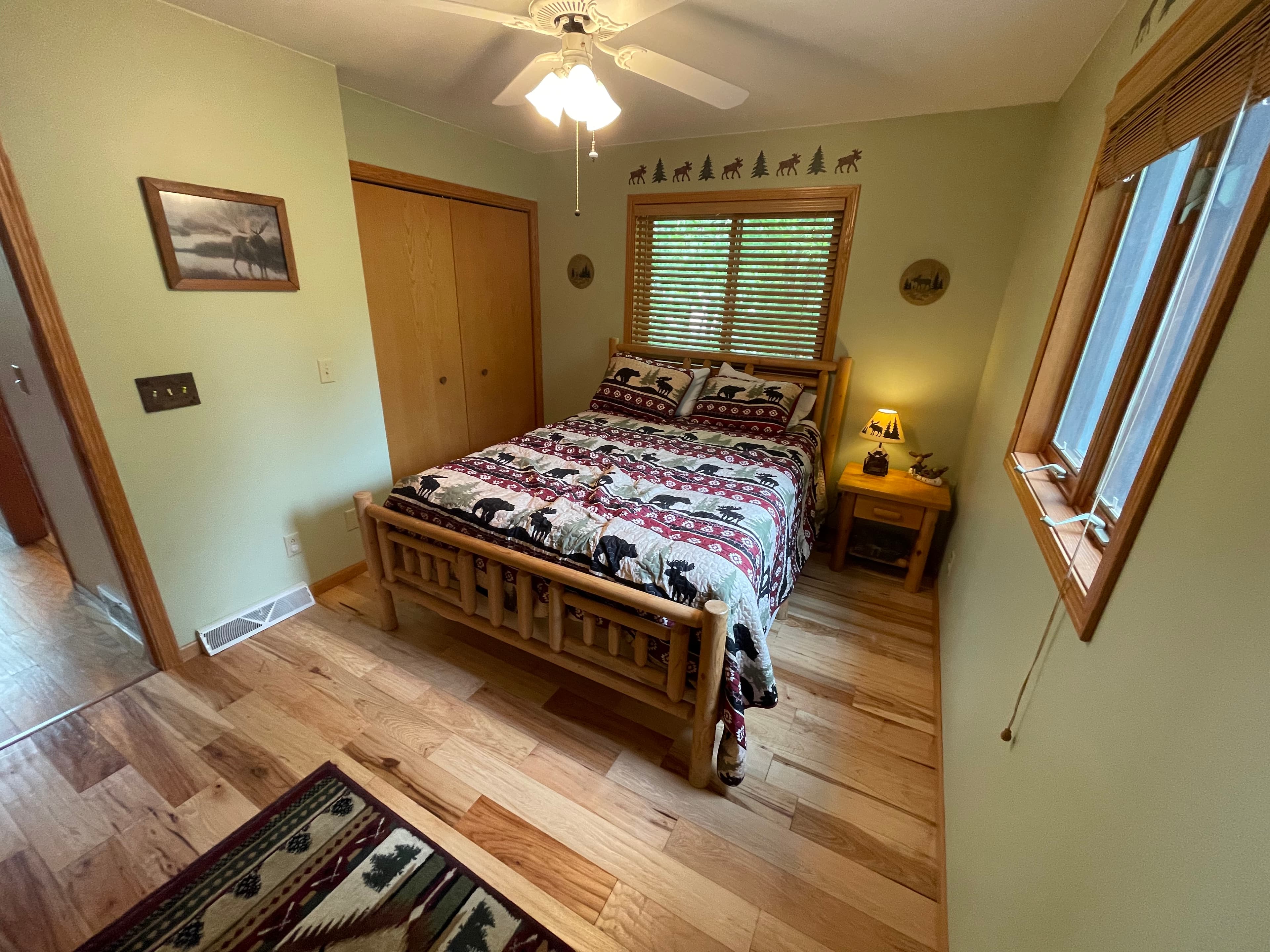 Main floor bedroom with hickory floors and amazing natural light