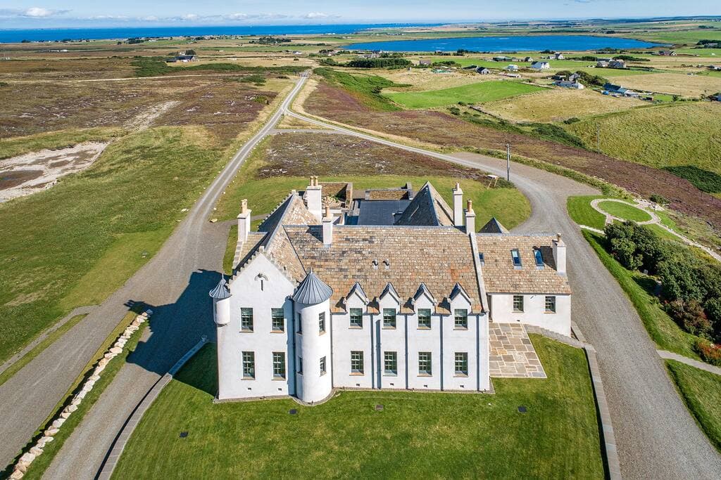 The house looking East to St John's Loch, the Castle of Mey and John O'Groats