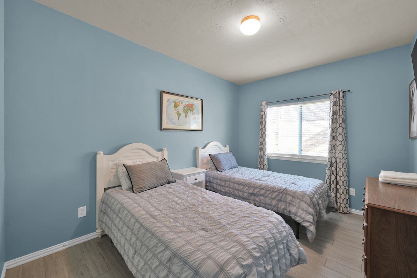 Twin bed room for kids or adults. Light and airy, but with light darkening curtains for great slumber. 
