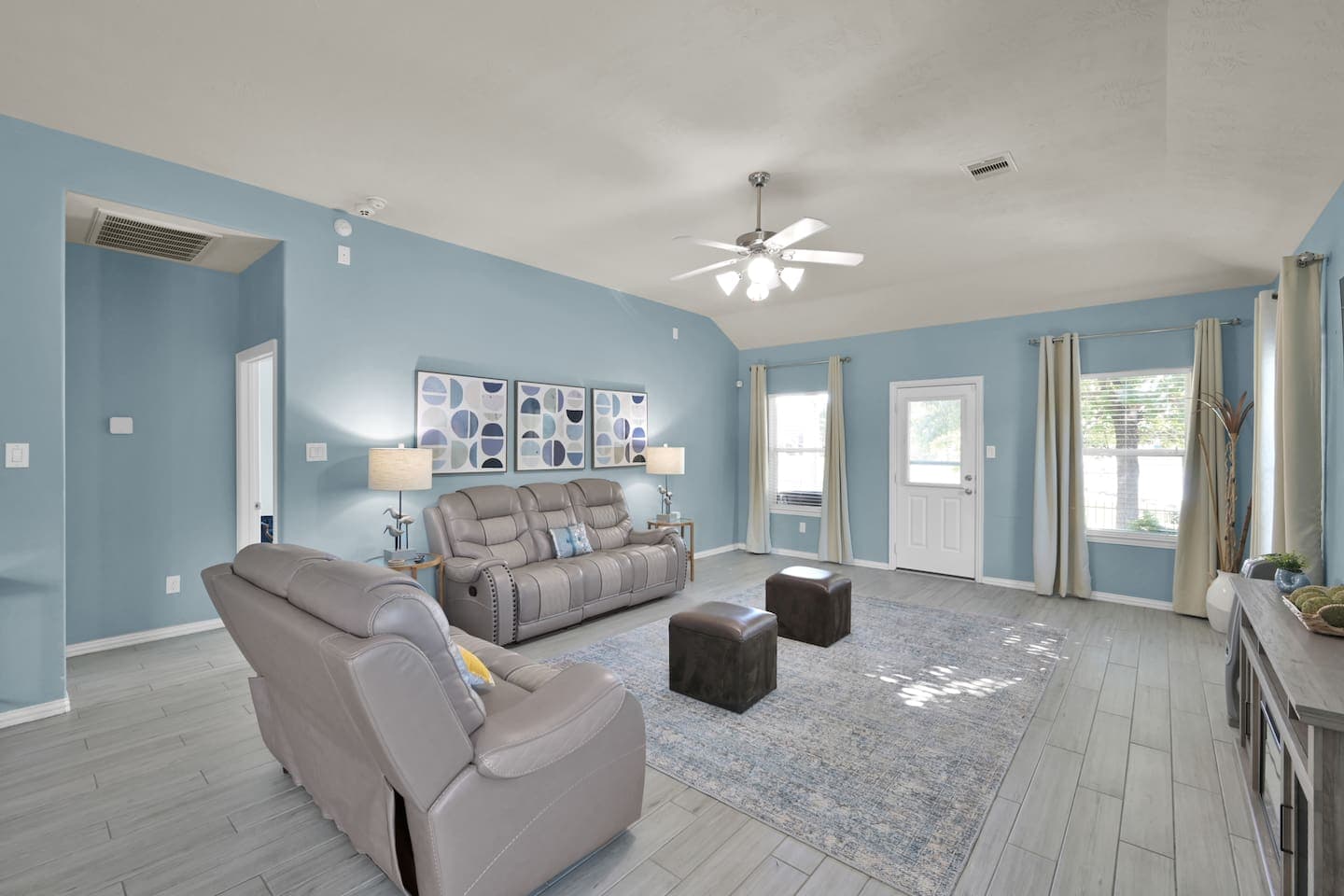 Professionally designed living room is a pleasure to host your guests. Live the lake life like kings and queens. Comfy recliners and footrests.  This space has an electric fireplace that adds the finishing touch for those chilly Texas winters. 