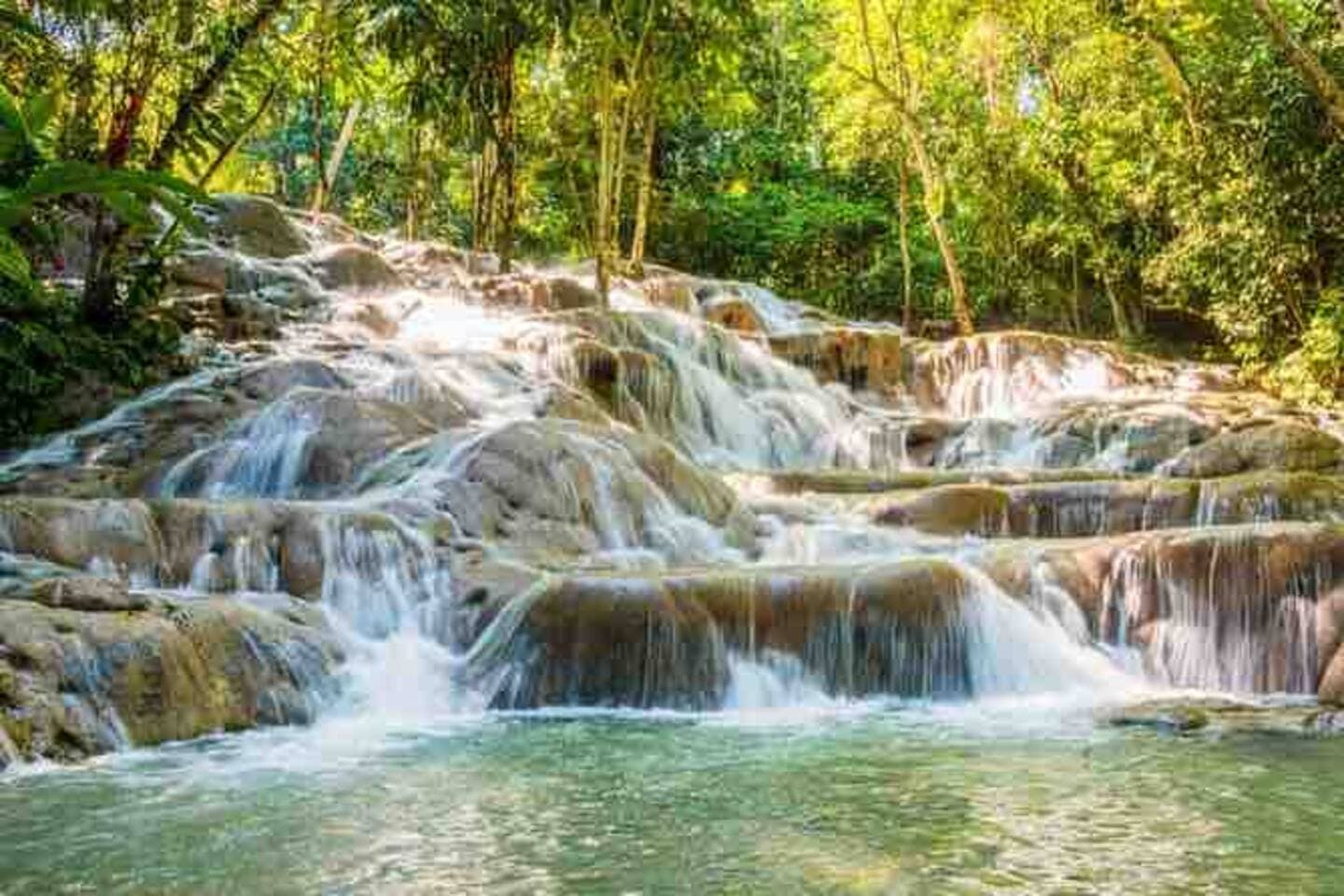 Pictures do not do justice to this unique waterfall. Half the fun is climbing up the rocks while bathing in the cool refreshing water. The other half is swimming in the warm ocean at the foot of the falls. 