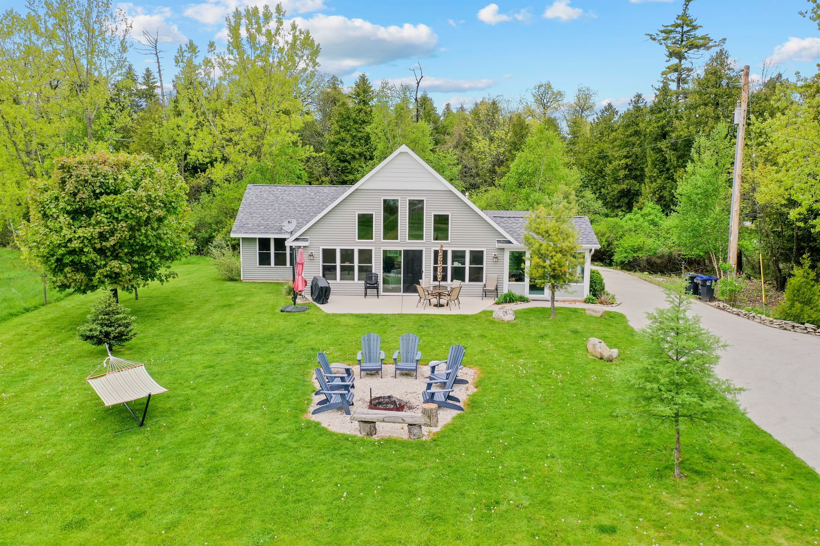 ull an Adirondack up and let the fire do the rest. Sawyer Harbor evenings are built around this spot — long conversations, cold drinks, and a sky full of stars you forgot existed.