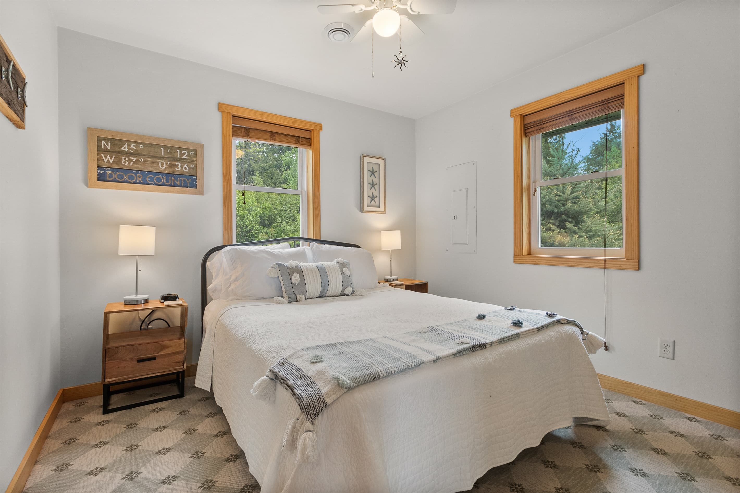 After a full day on the water, this is where you land. Queen bed, quiet corner of the cottage, ceiling fan, natural light. No complaints from anyone who's slept here.