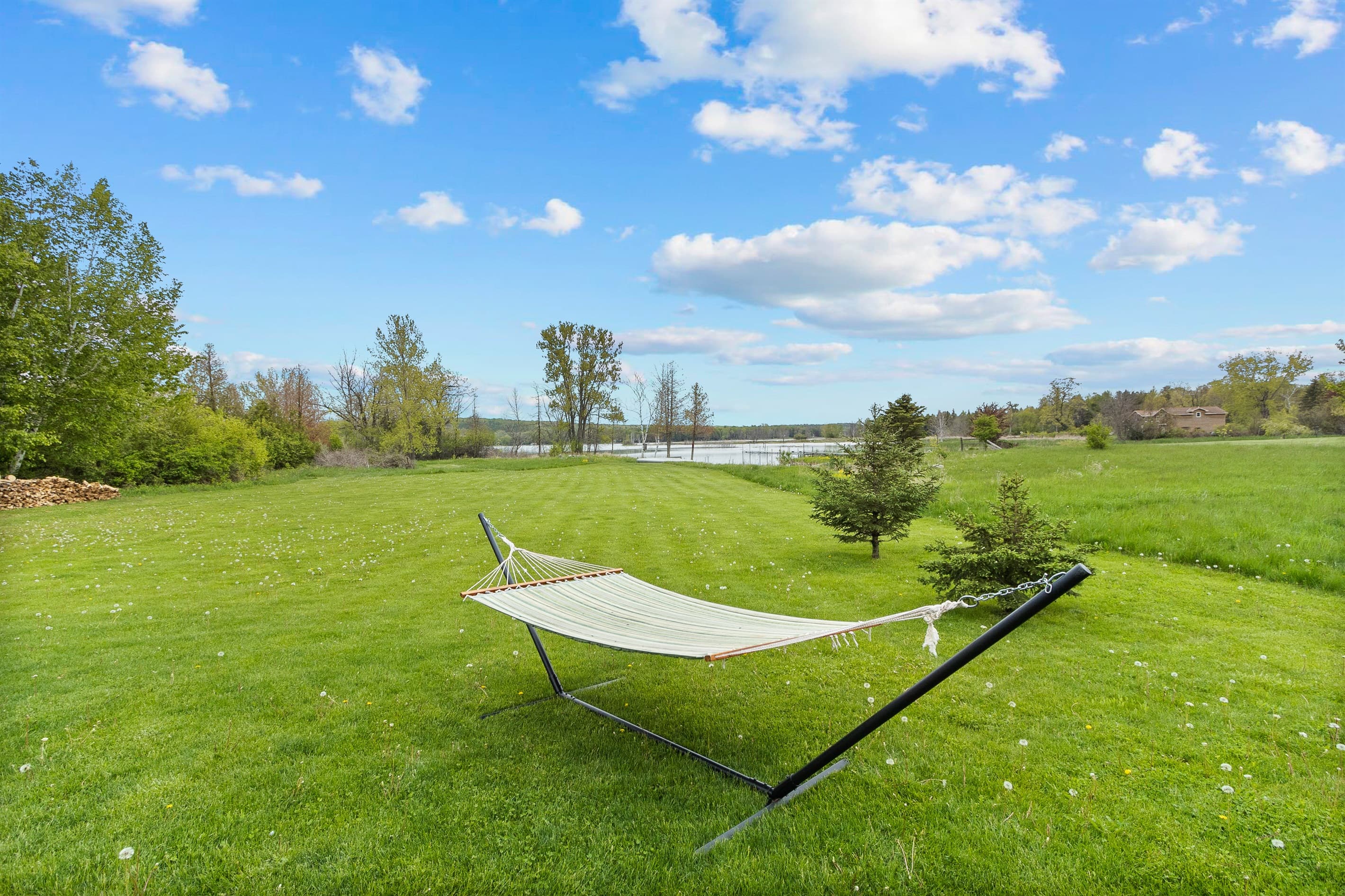 Spend a relaxing day in the beautiful backyard hammock, with gorgeous views of Sawyer Harbor.