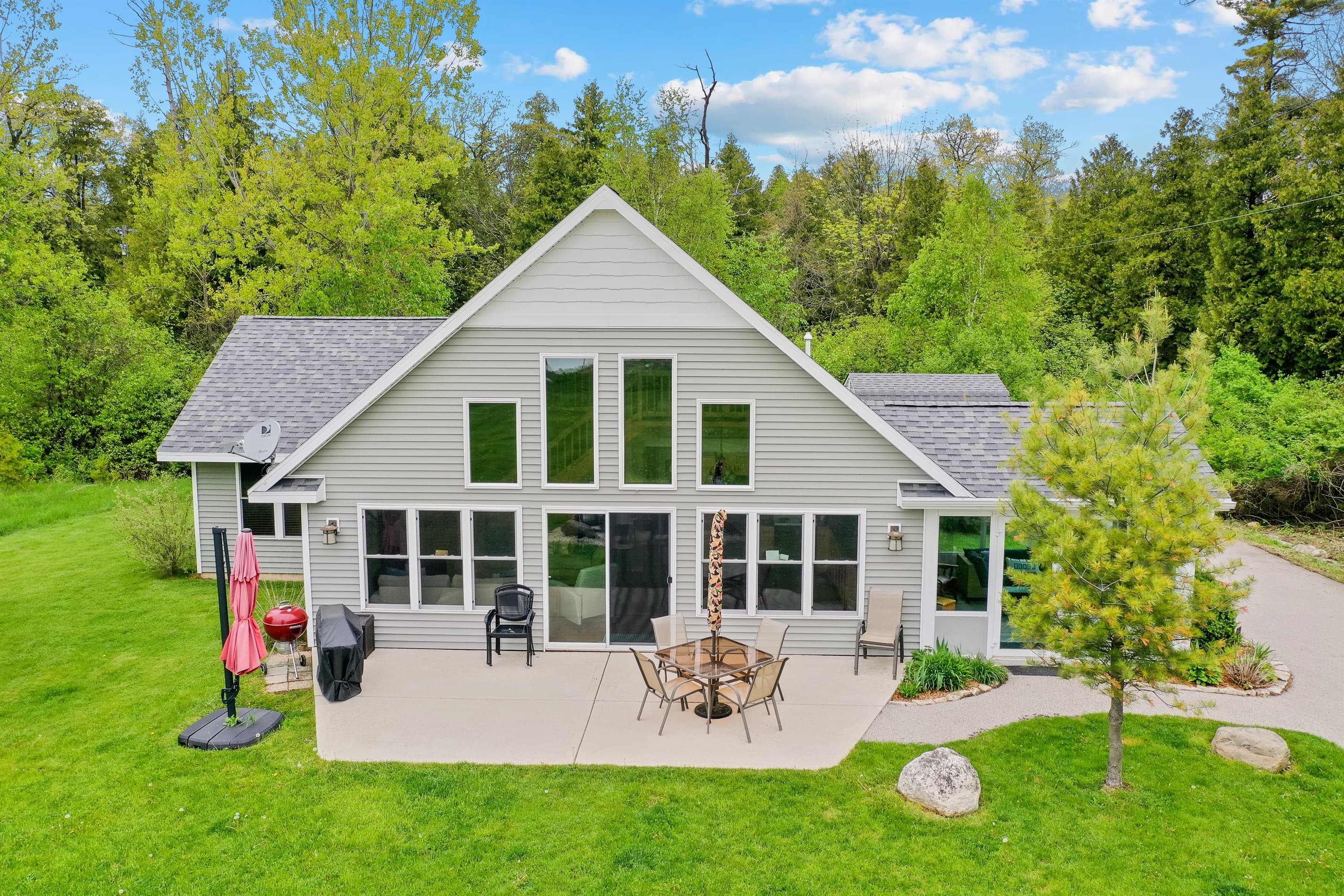 Sawyer Harbor Retreat is the perfect cottage for a Door County vacation. The south-facing windows give a beautiful view of the harbor and the large patio is perfect for relaxing under the umbrella.