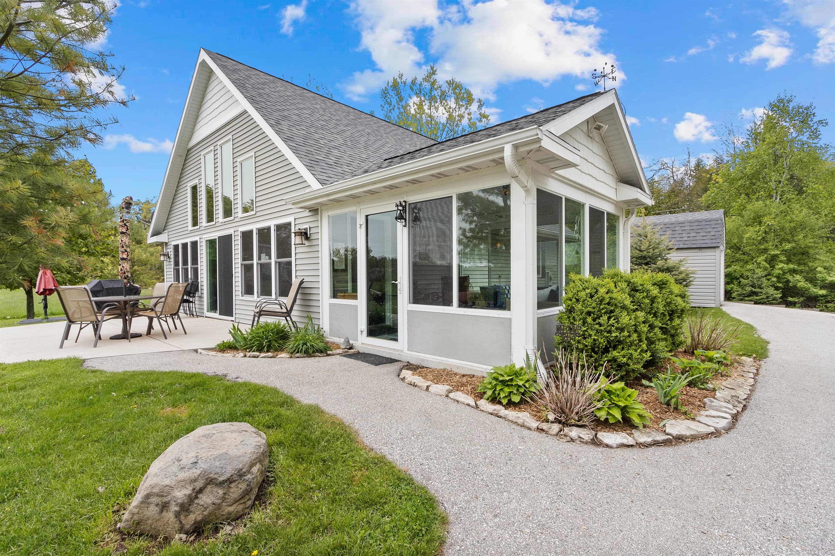 The screened-in sun porch is one our favorite rooms at the cottage. It's like an outdoor (ish) living room!  It's great for cool mornings or quiet evenings.