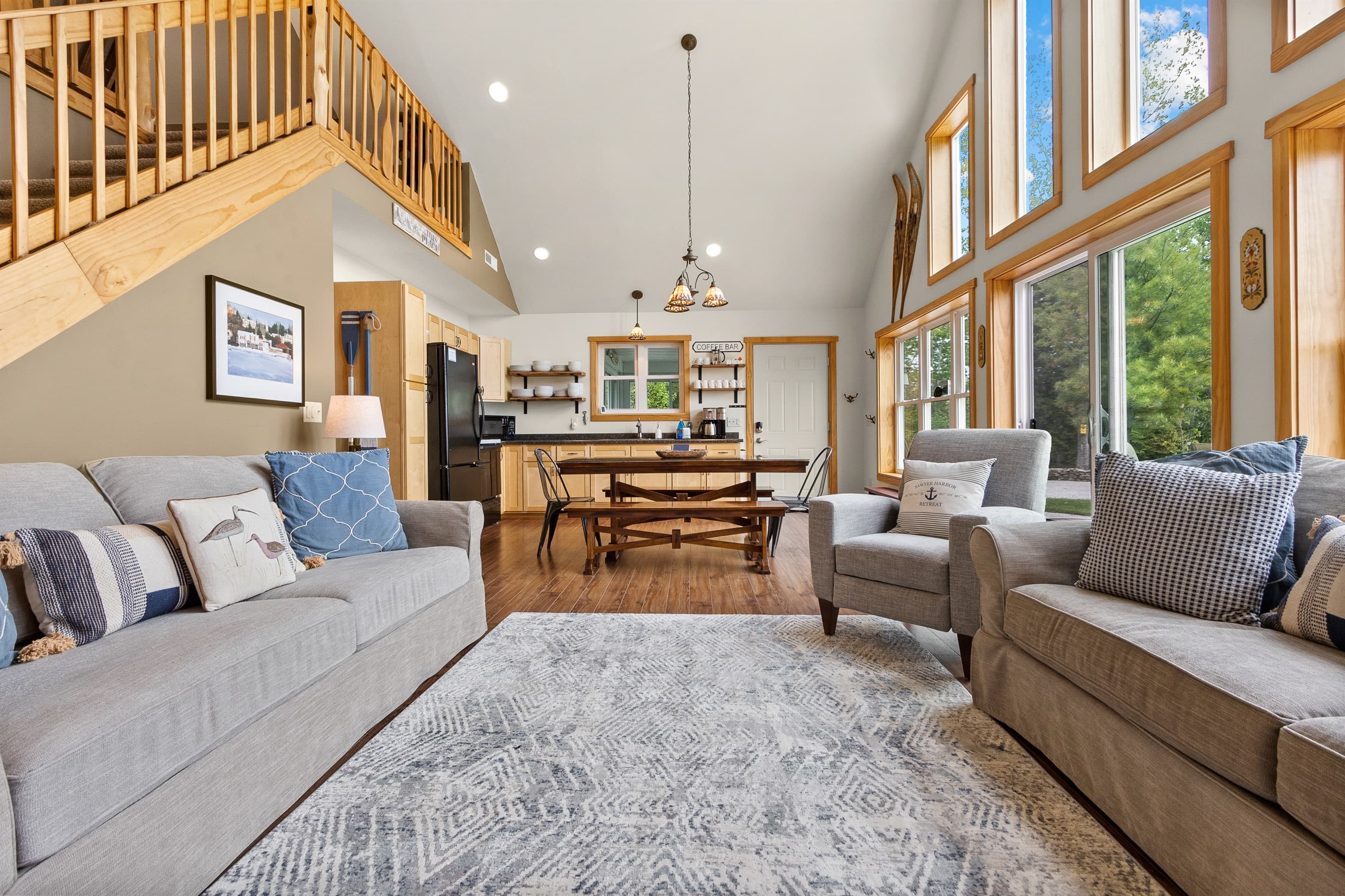 Open plan from front door to back windows — you never lose sight of the harbor from the main floor, whether you're cooking, eating, or just standing there with a coffee.