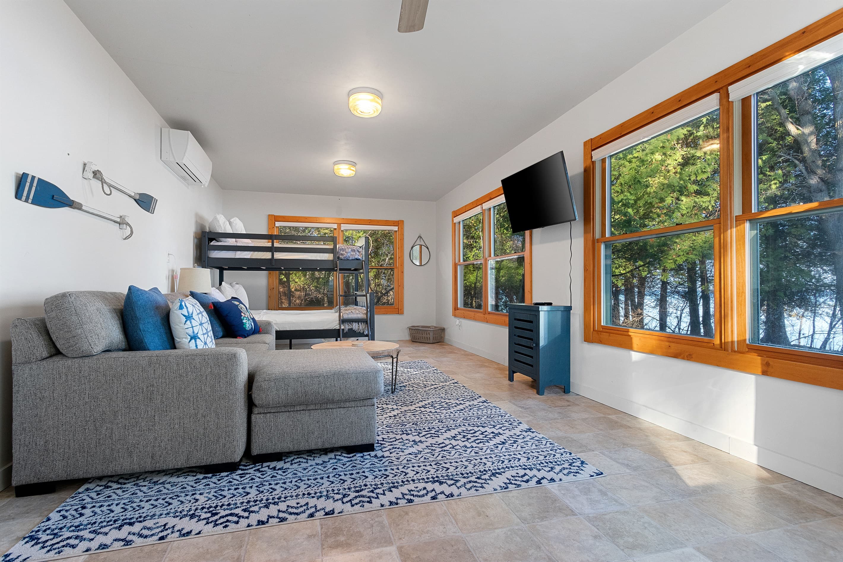 The kids claimed this spot before they even unpacked — their own cottage, their own TV, their own adventure headquarters for the week. (Parents appreciate the separation just as much.)