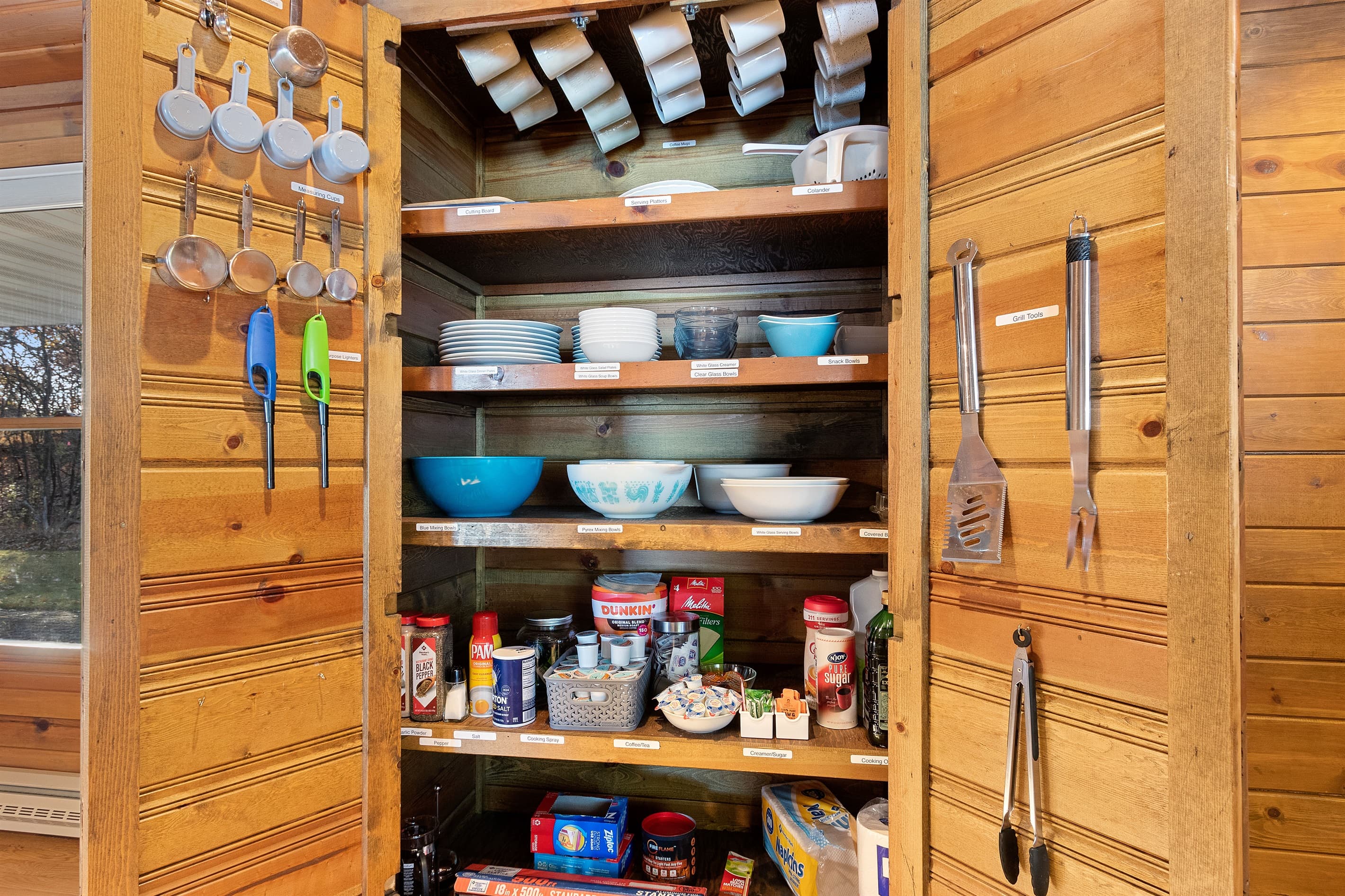Every shelf is labeled. Every item is there. This is a kitchen where family dinners actually happen — not one where you're hunting for a colander at 6pm.