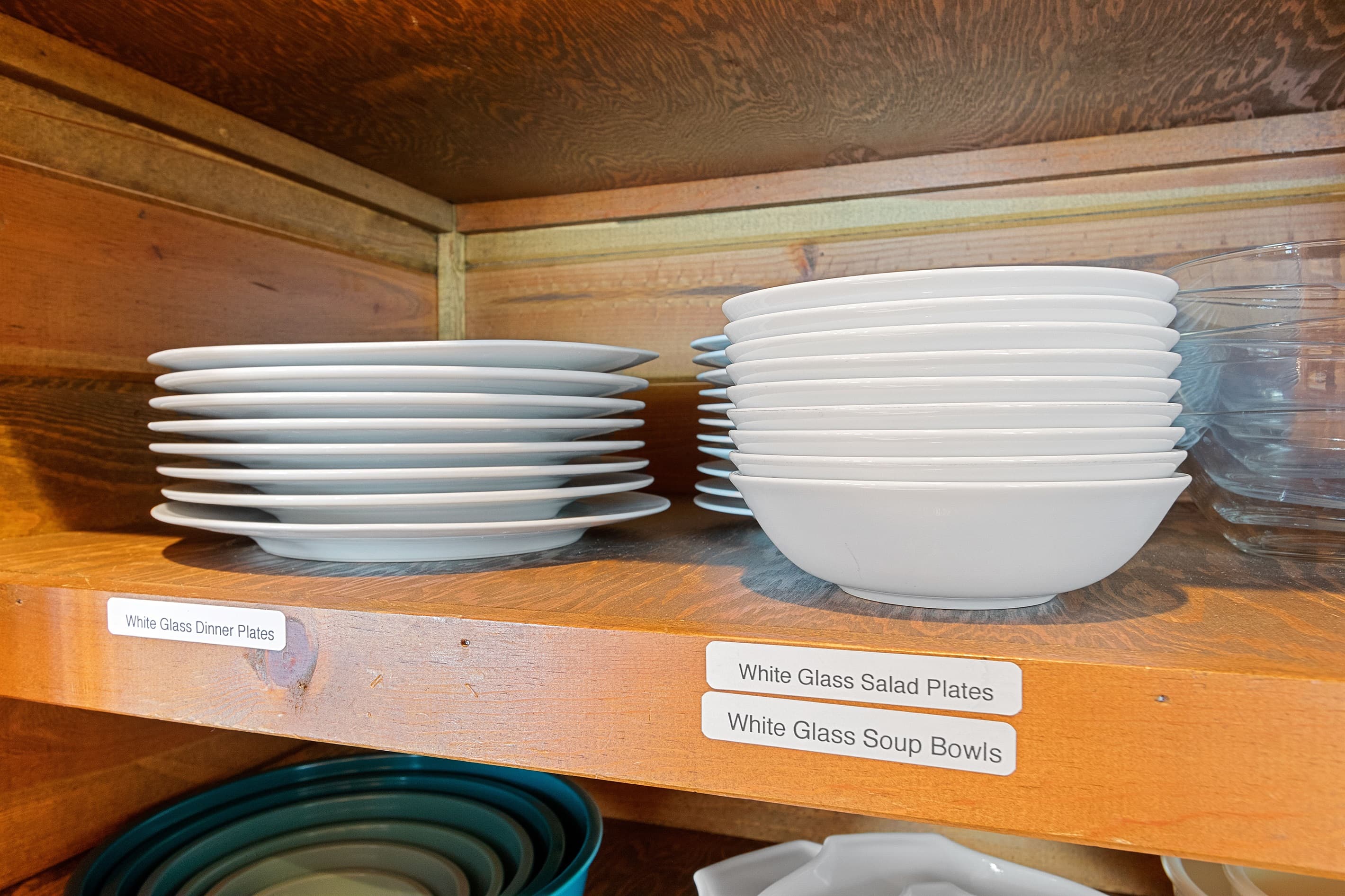 Dinner for ten shouldn't require a scavenger hunt. Every plate, bowl, and dish is labeled and ready. Show up, cook, and eat together — that's the whole idea.