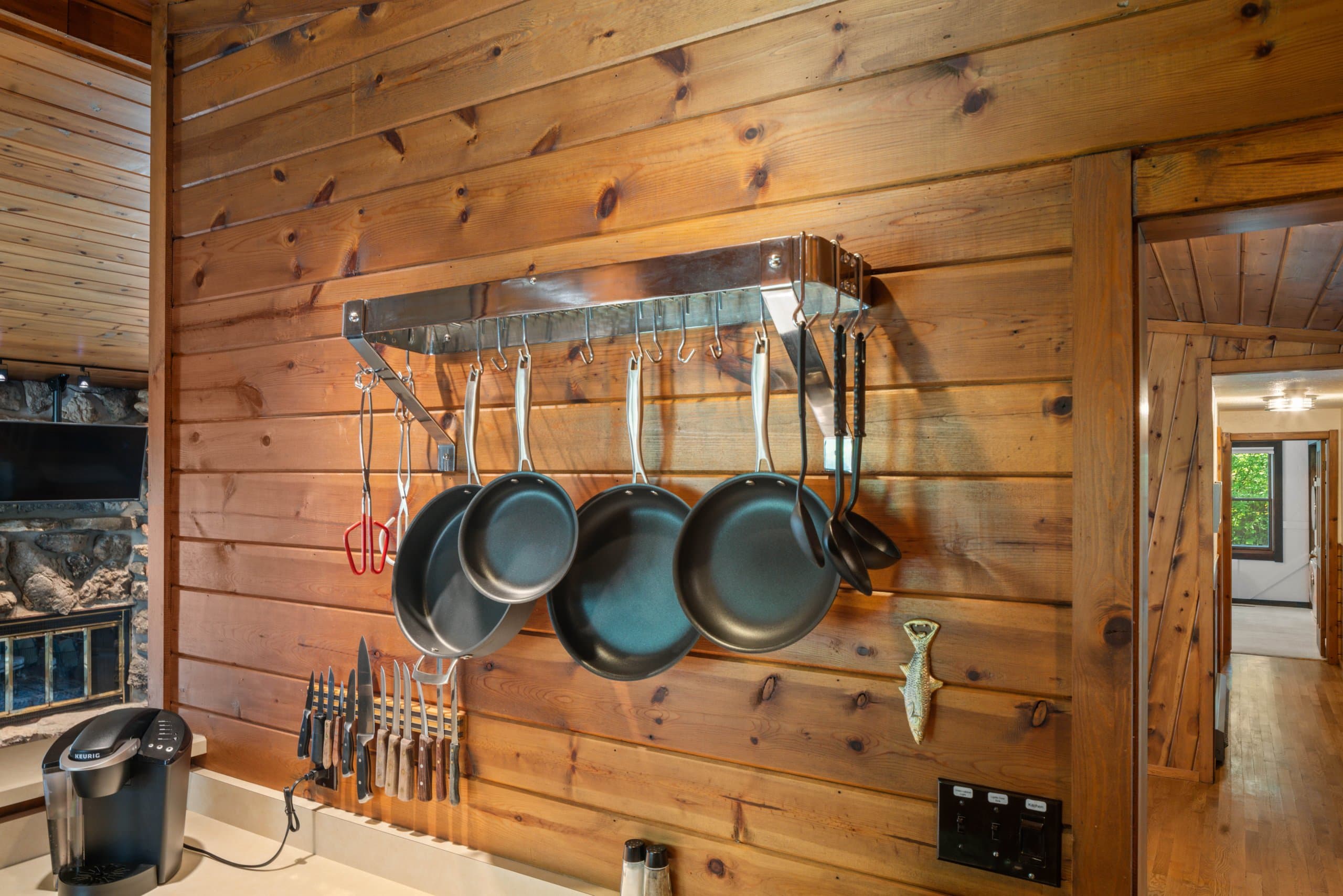 Everything within reach: pots, pans, spices, and a hallway that leads right to the bedrooms. This is a cottage that flows the way a group needs it to.