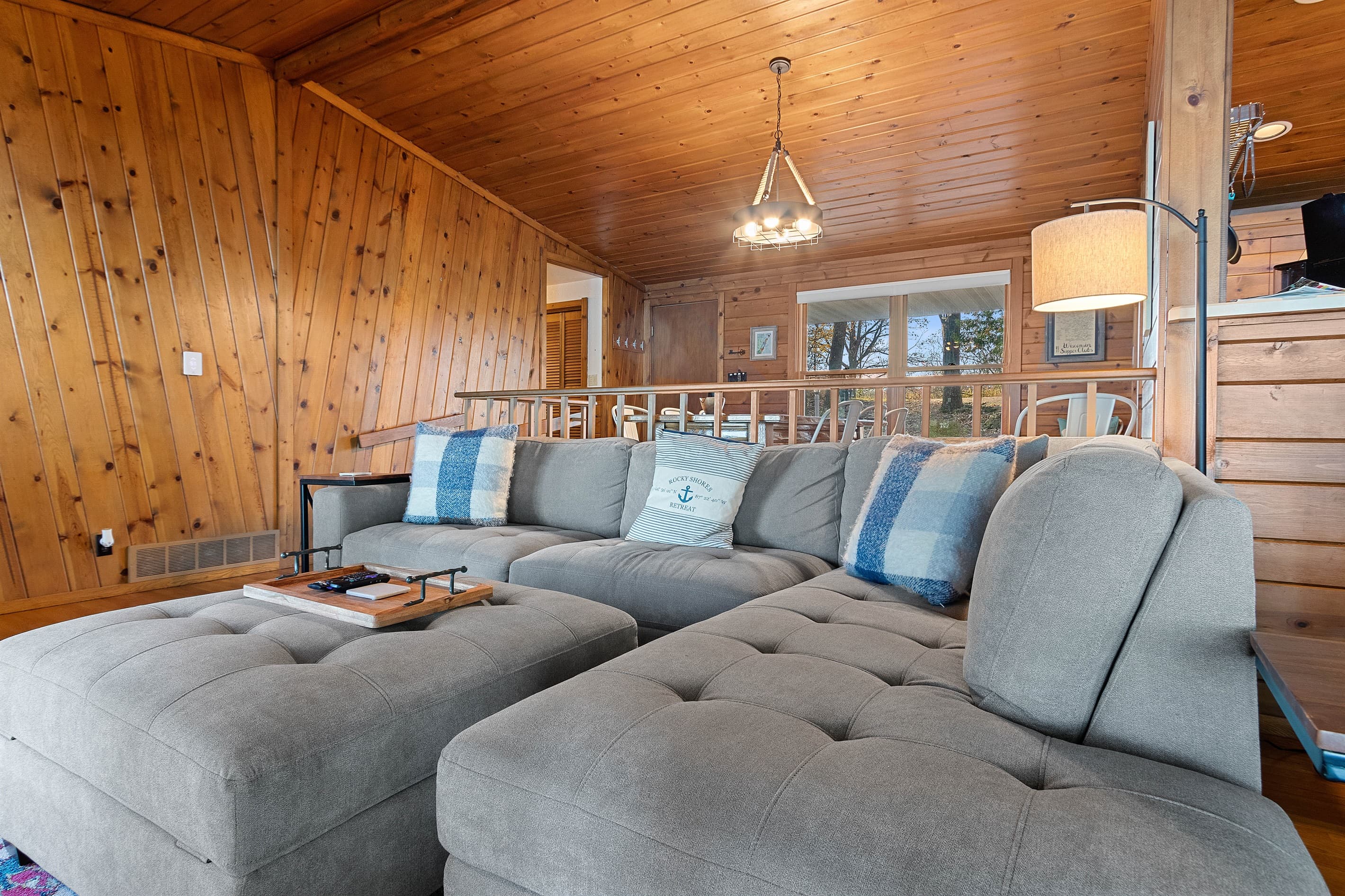 The sectional wraps around just right for movie nights, lazy mornings, and the kind of conversations that go until midnight. Named pillows and all — this place knows who it is.