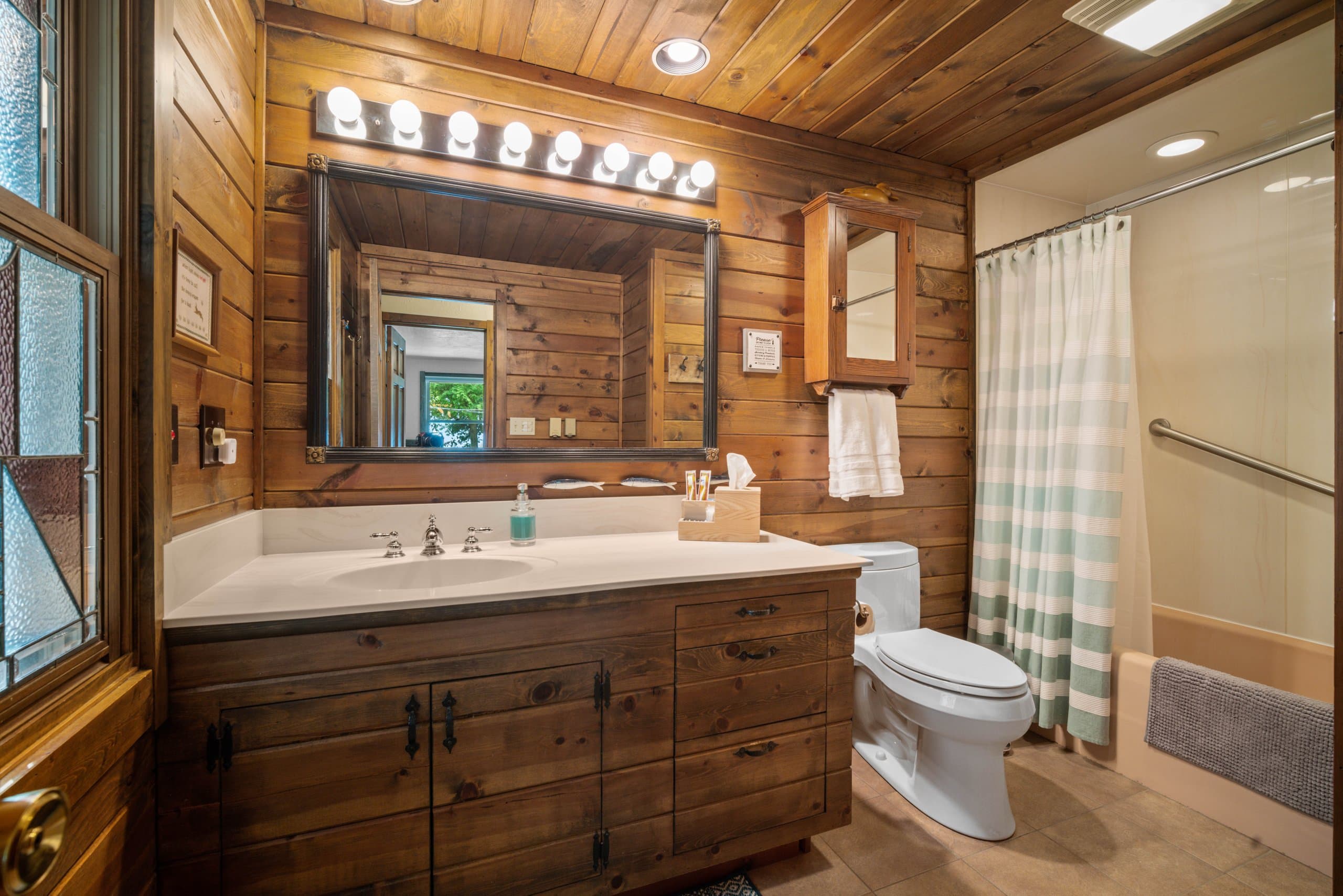 The full bathroom features a heater just outside the shower.