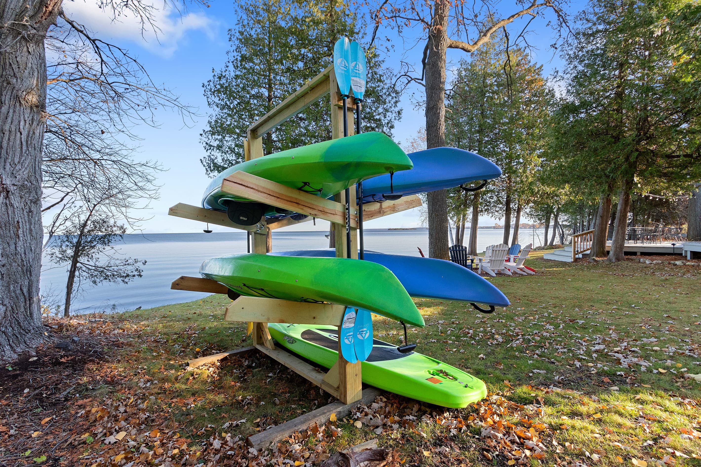 Four kayaks. The rack is right there, the bay is right there, and the only decision is who gets the green one.