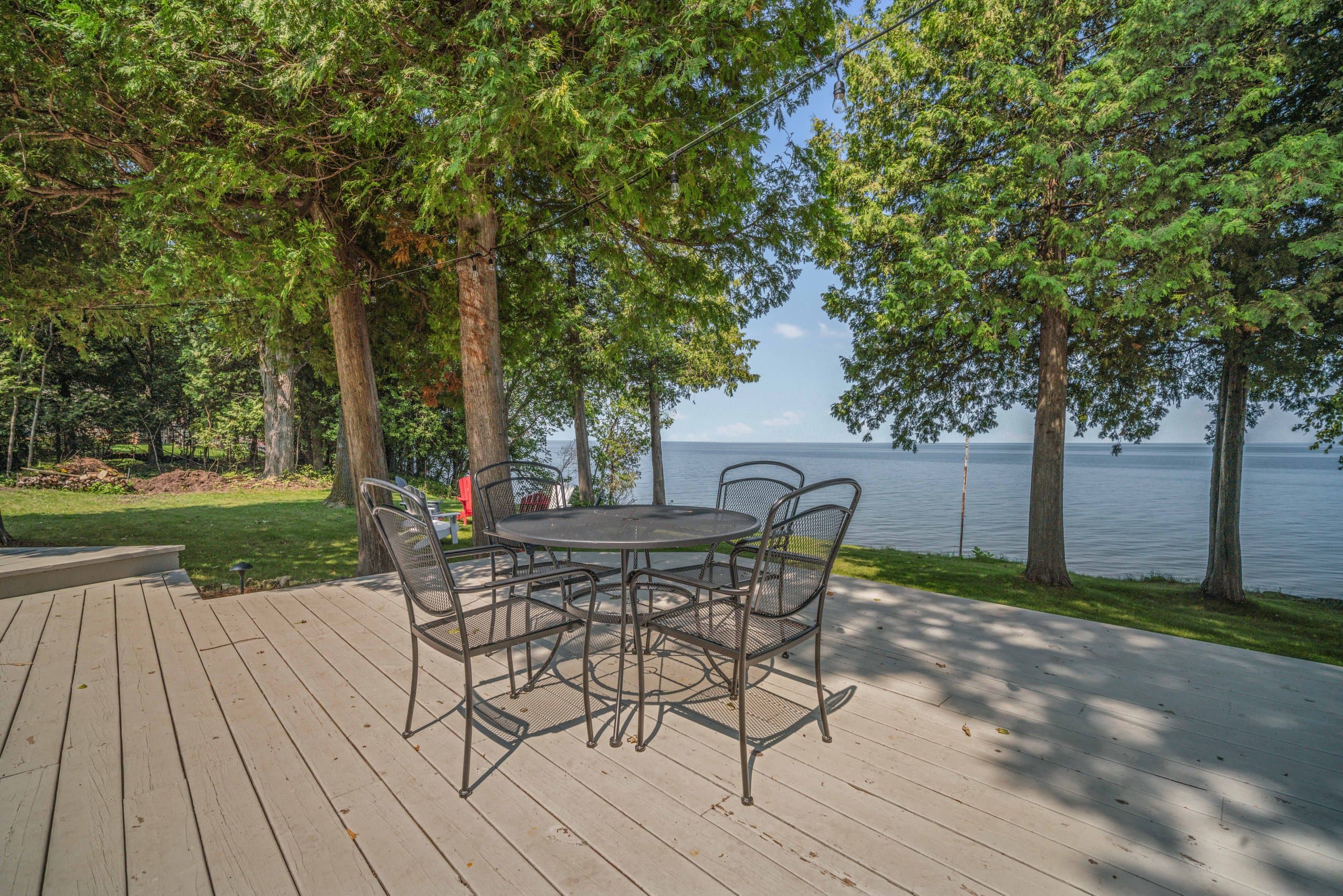 The large deck overlooking the water is the most relaxing spot at Rocky Shores. You'll find ample seating for the whole family and it's a great spot for an outdoor breakfast, dinner or just a great place to spend time until the lights in the evening.