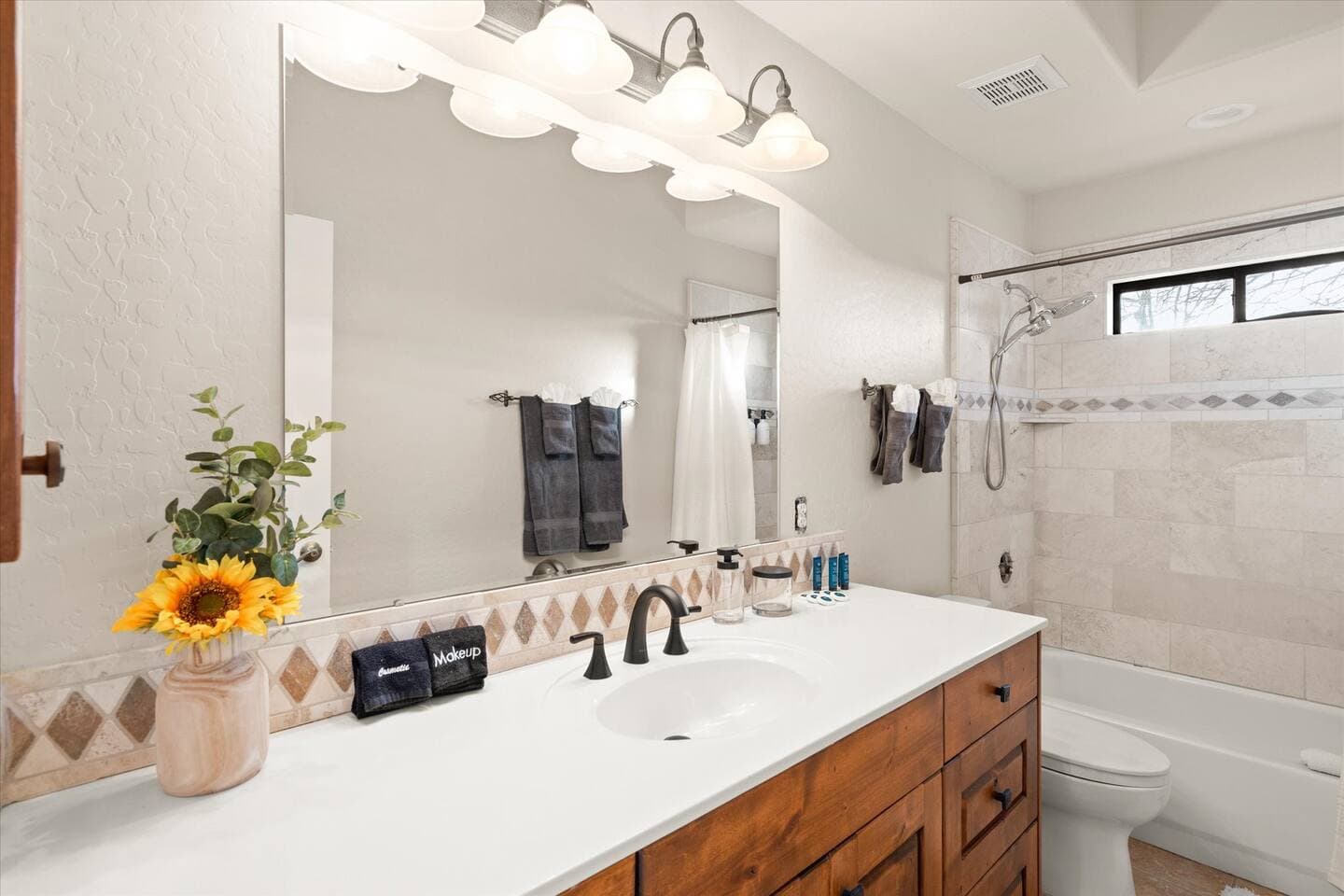 Large full bath serves all your families needs. With a tub and a shower, removable shower head, hair dryer, and plenty of extra towels, everyone will be happy and squeaky clean!