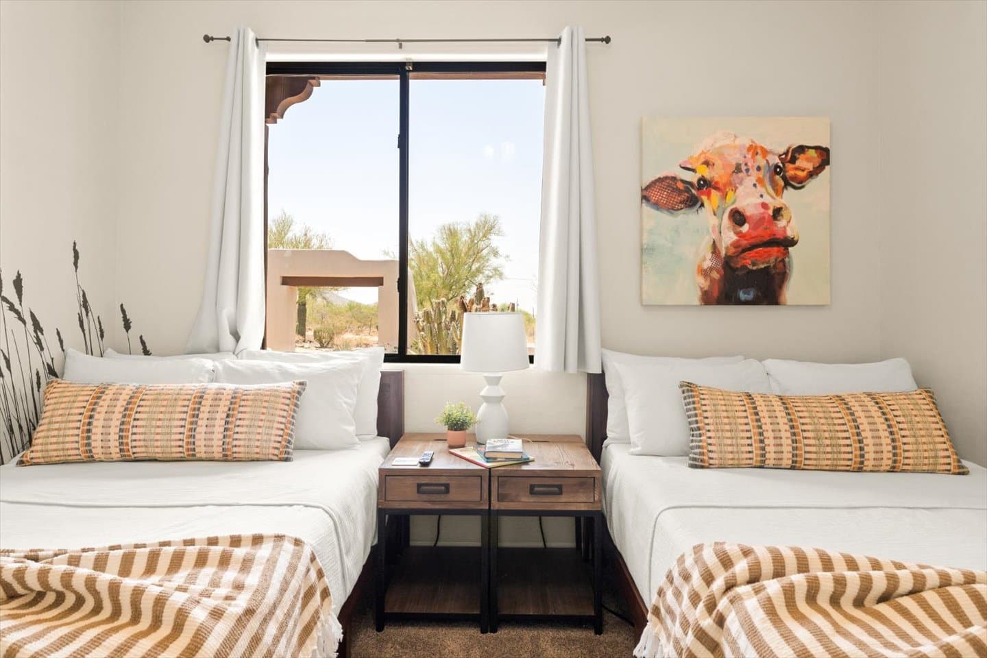 Say Howdy to the Corral! Our multi-purpose bedroom featuring two comfortable full beds with white noise fan and USB plugs plus a huge TV to help wind the kids down at night.