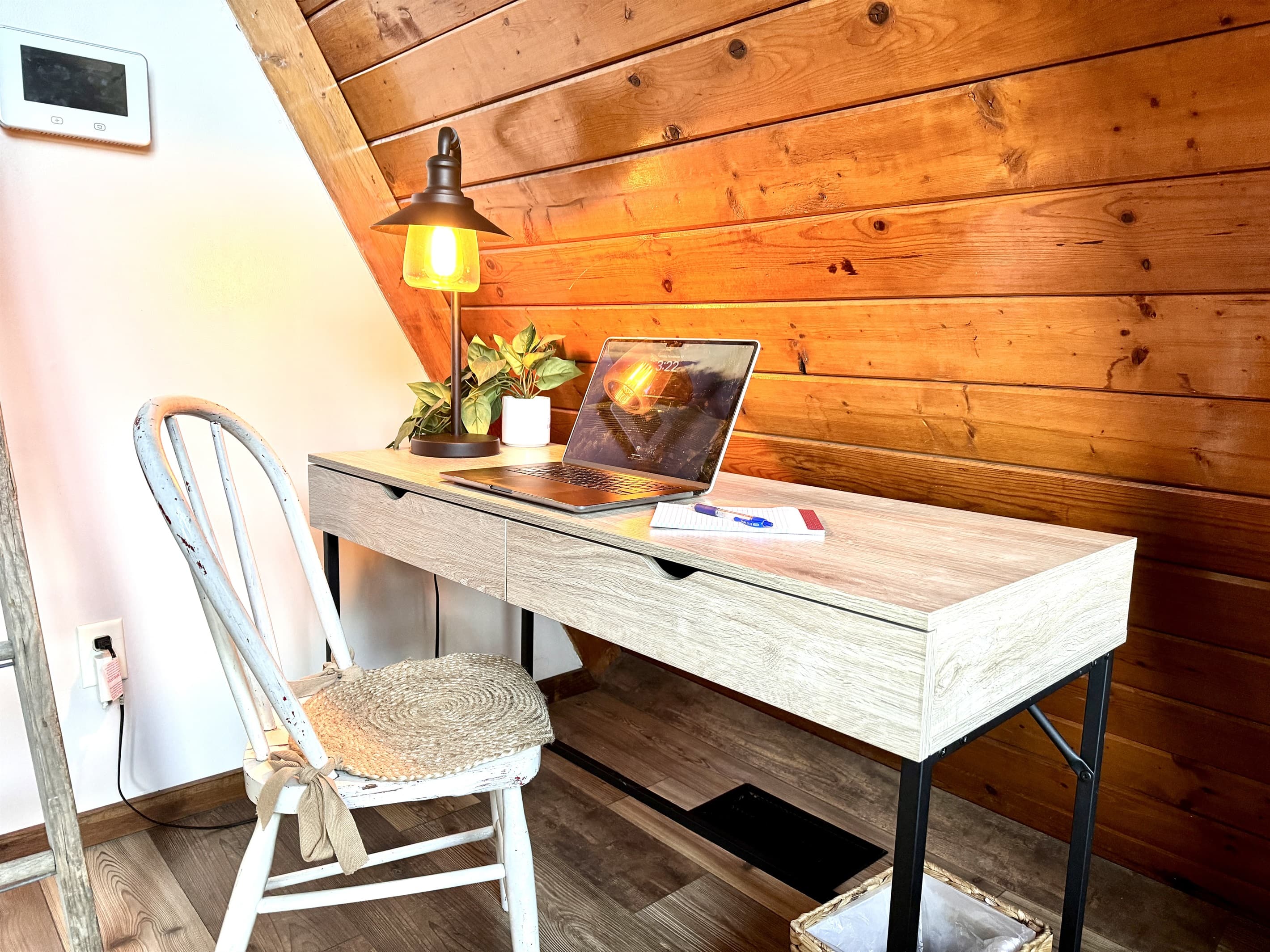 Get a little work done while you enjoy the cozy feel of The Ridge's living room and 20 foot apex window with lake views. (Laptop not included)