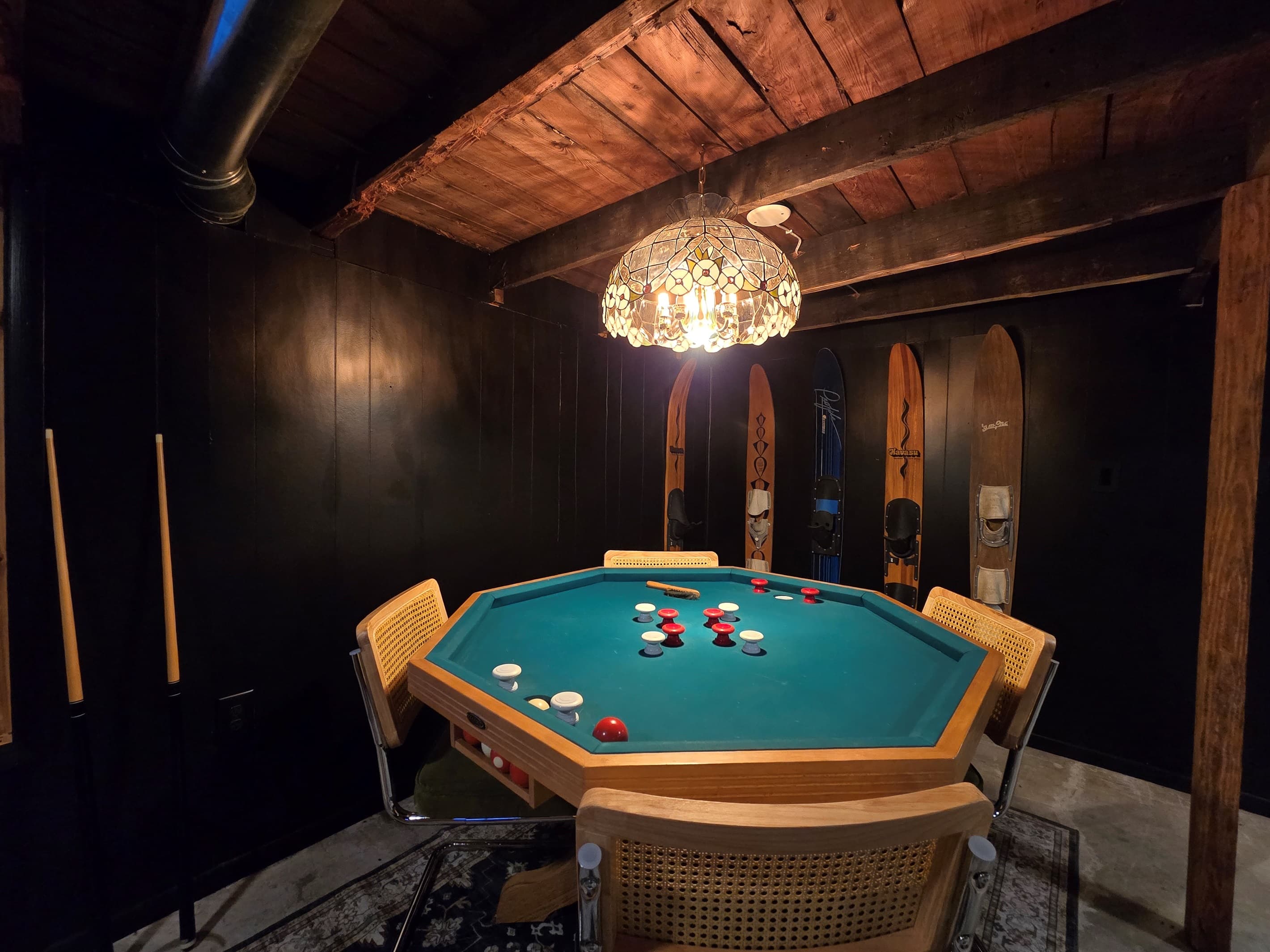 - Enjoy game nights at this vintage game room table   - Retro decor blends with warm cabin-style woods   - A fun hangout spot for friendly competition