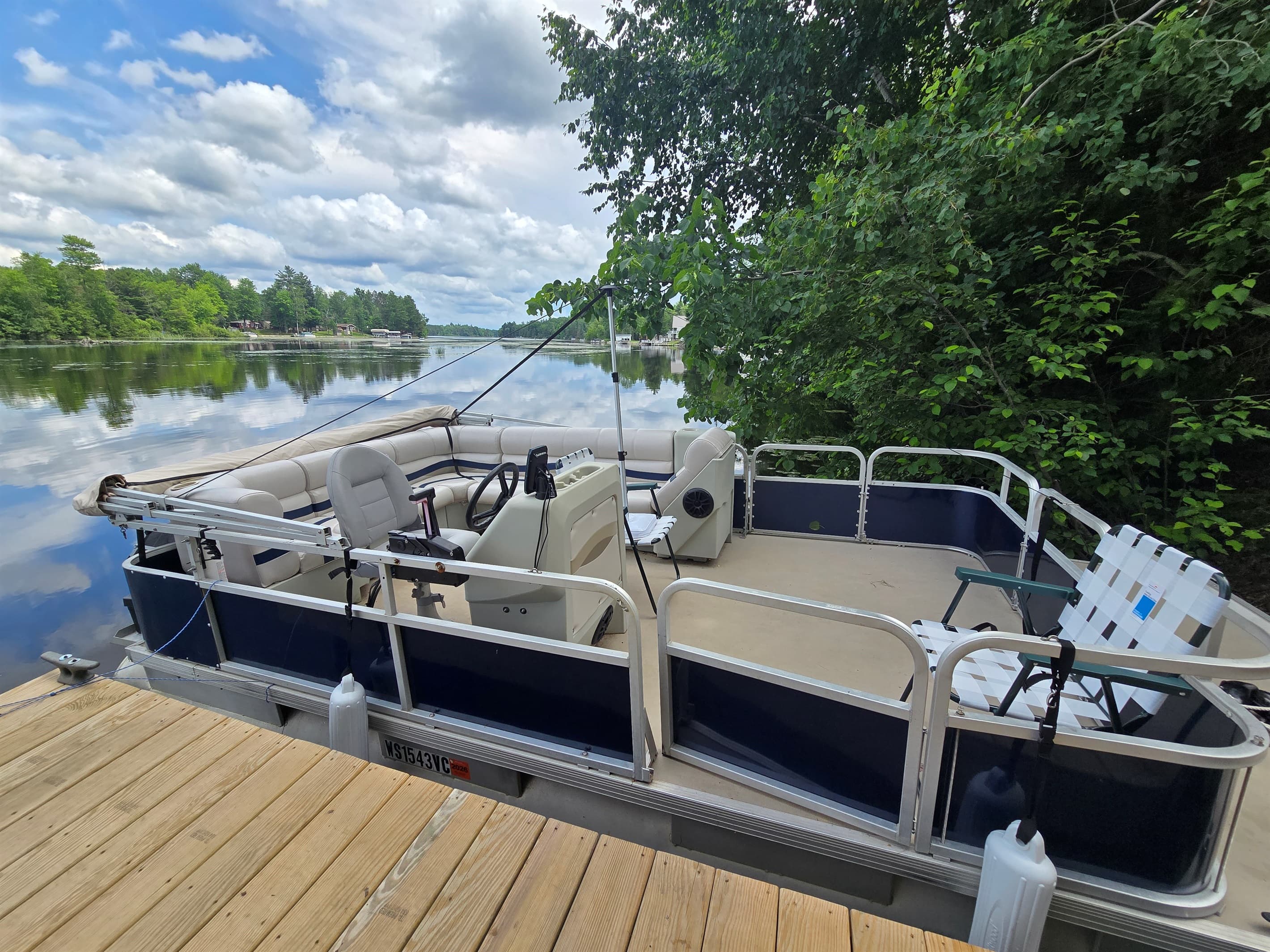 - Enjoy peaceful lake days with this spacious pontoon   - Relax on calm water and take in scenic shoreline views   - A perfect lakeside setup for slow cruises and fun outings