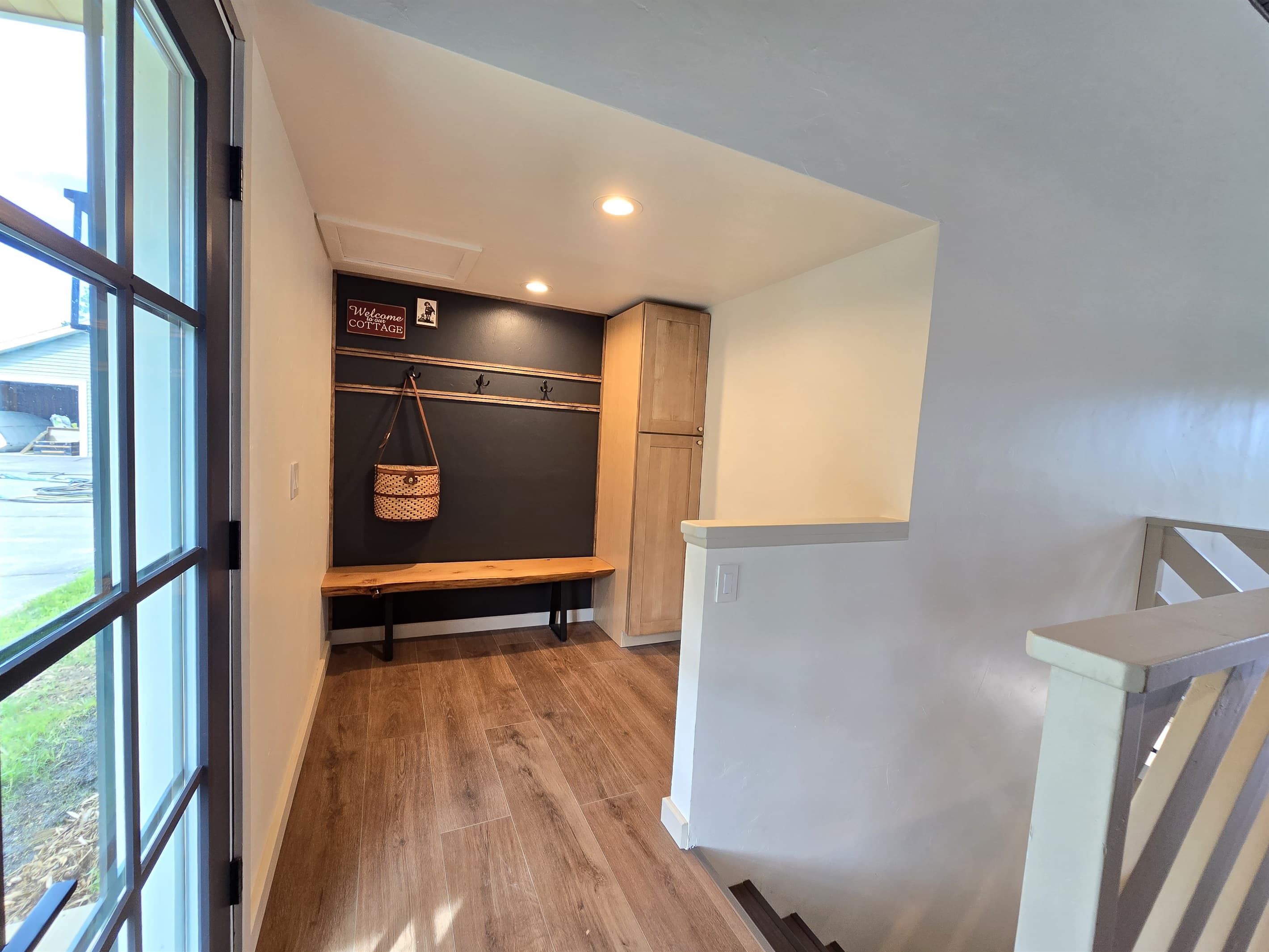 - Bright entryway with bench seating and storage hooks   - Easy spot to drop bags and gear when arriving   - Welcoming layout designed for simple guest comfort