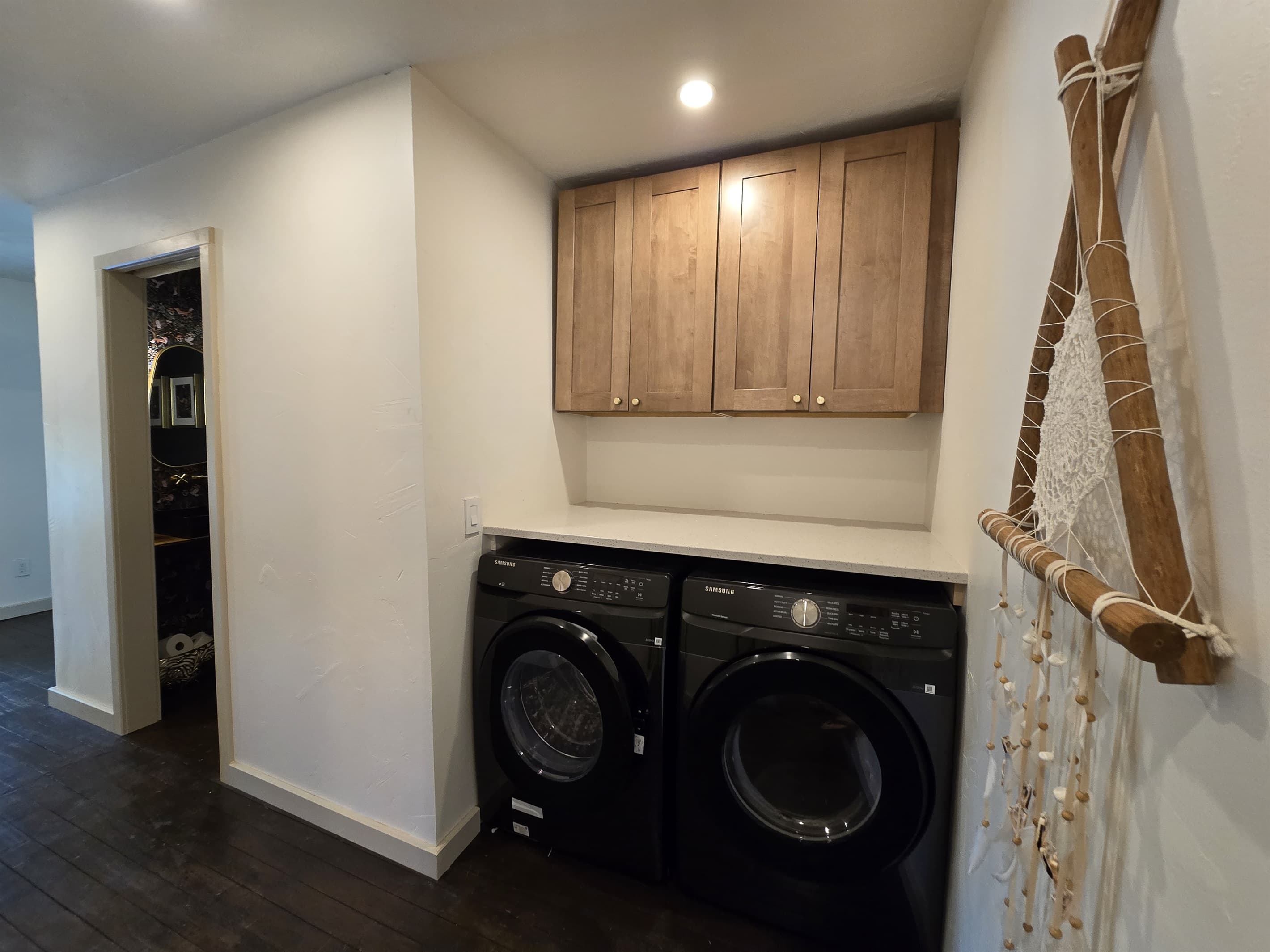 - Laundry area with modern machines and storage   - Clean organized space for guest convenience   - Easy routines during longer lakefront stays