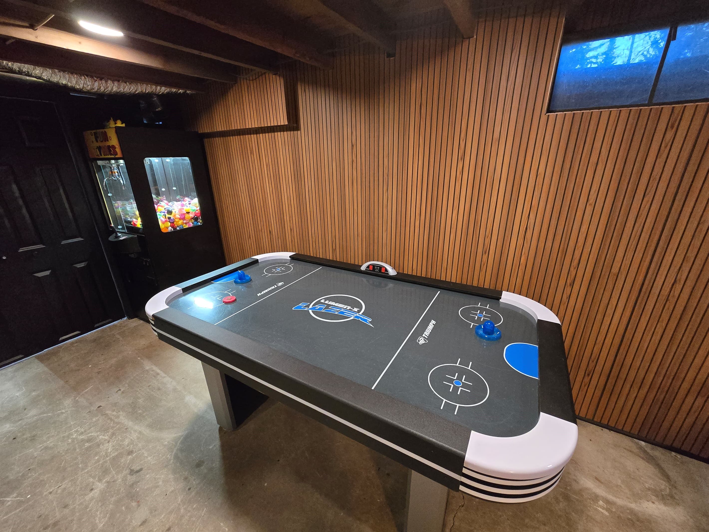 - Air hockey table ready for tournaments and laughs   - Bright game room design creates energetic vibes   - Ideal for rainy days or evening entertainment