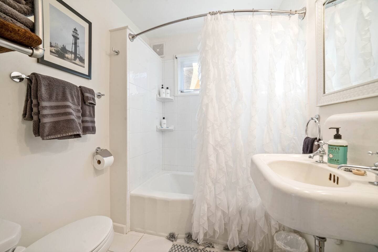 Bathroom on the main level. Washer and dryer across from the bathroom.