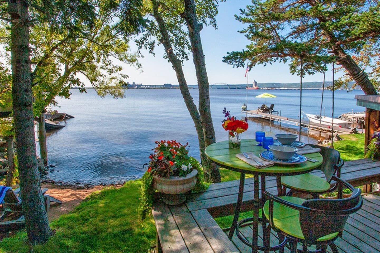 Tasty treats on the deck while your toes are practically touching the bay!Yes, those chairs and fishing poles on the dock are waiting for you!