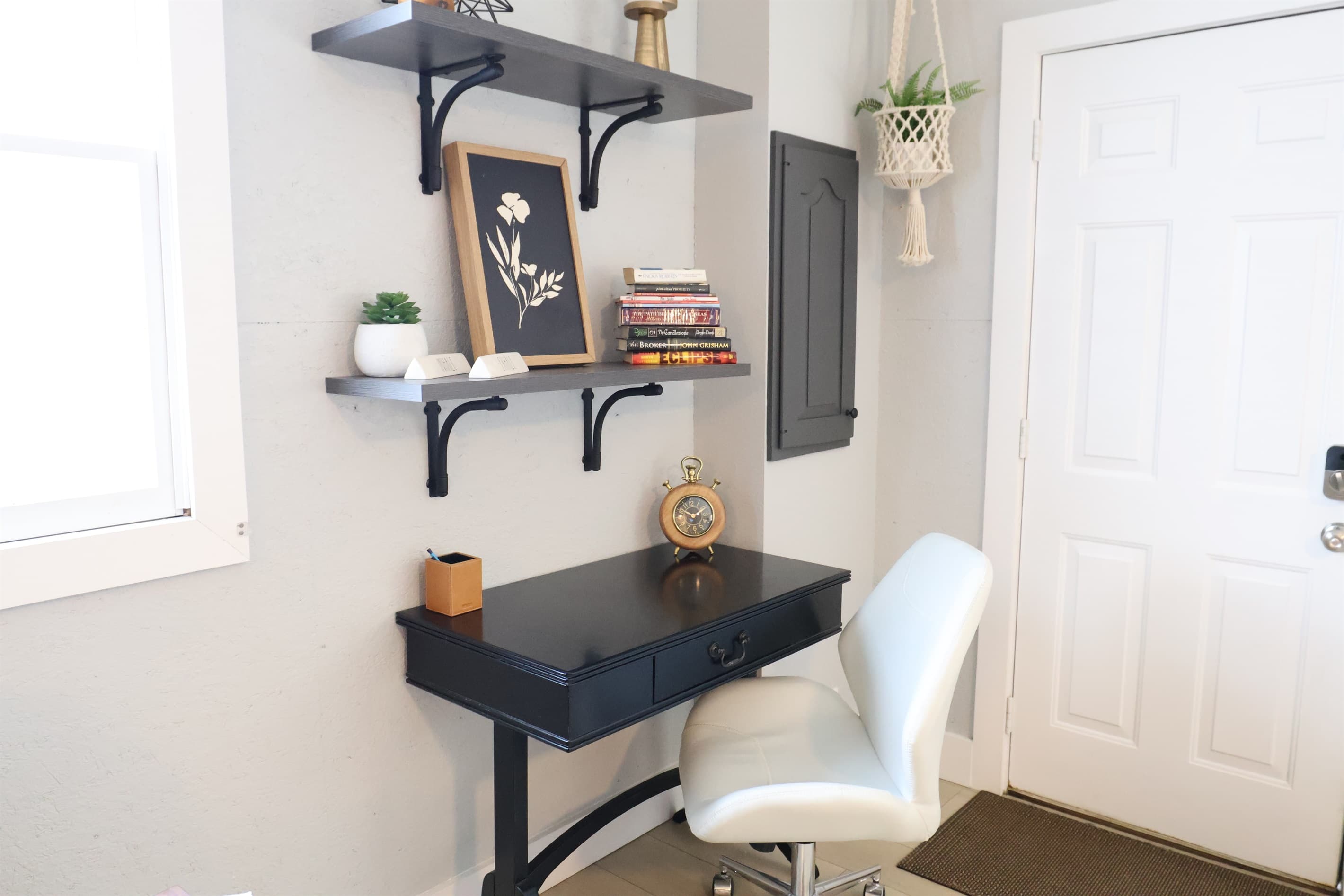 Comfortable desk for working (if you HAVE to!) plus a small little library should you have the time.