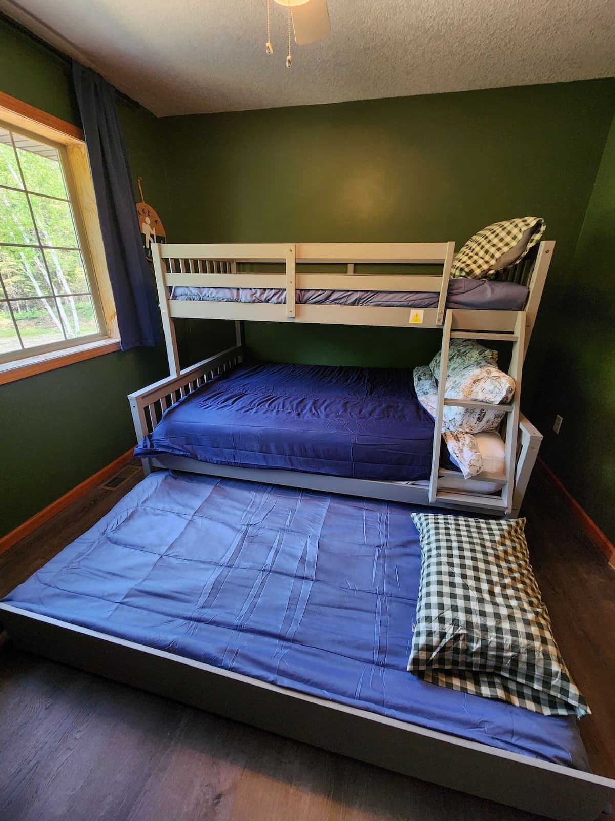 Twin over full sized bunk bed with twin sized trundle- Top bunks will have the clean bedding folded and laid on top of them due to cleaning team requirements