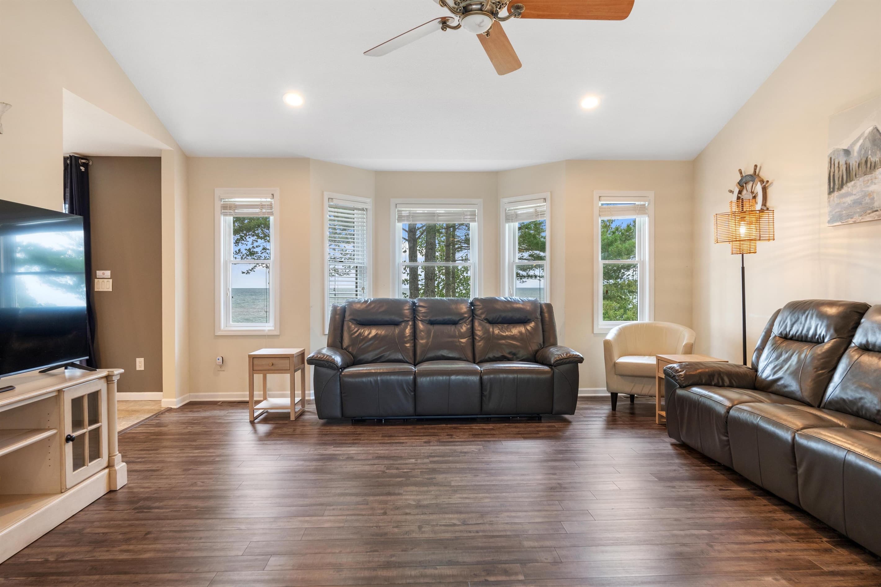 Reclining Leather sofas and 65" Smart TV with high speed internet, all with beautiful water views