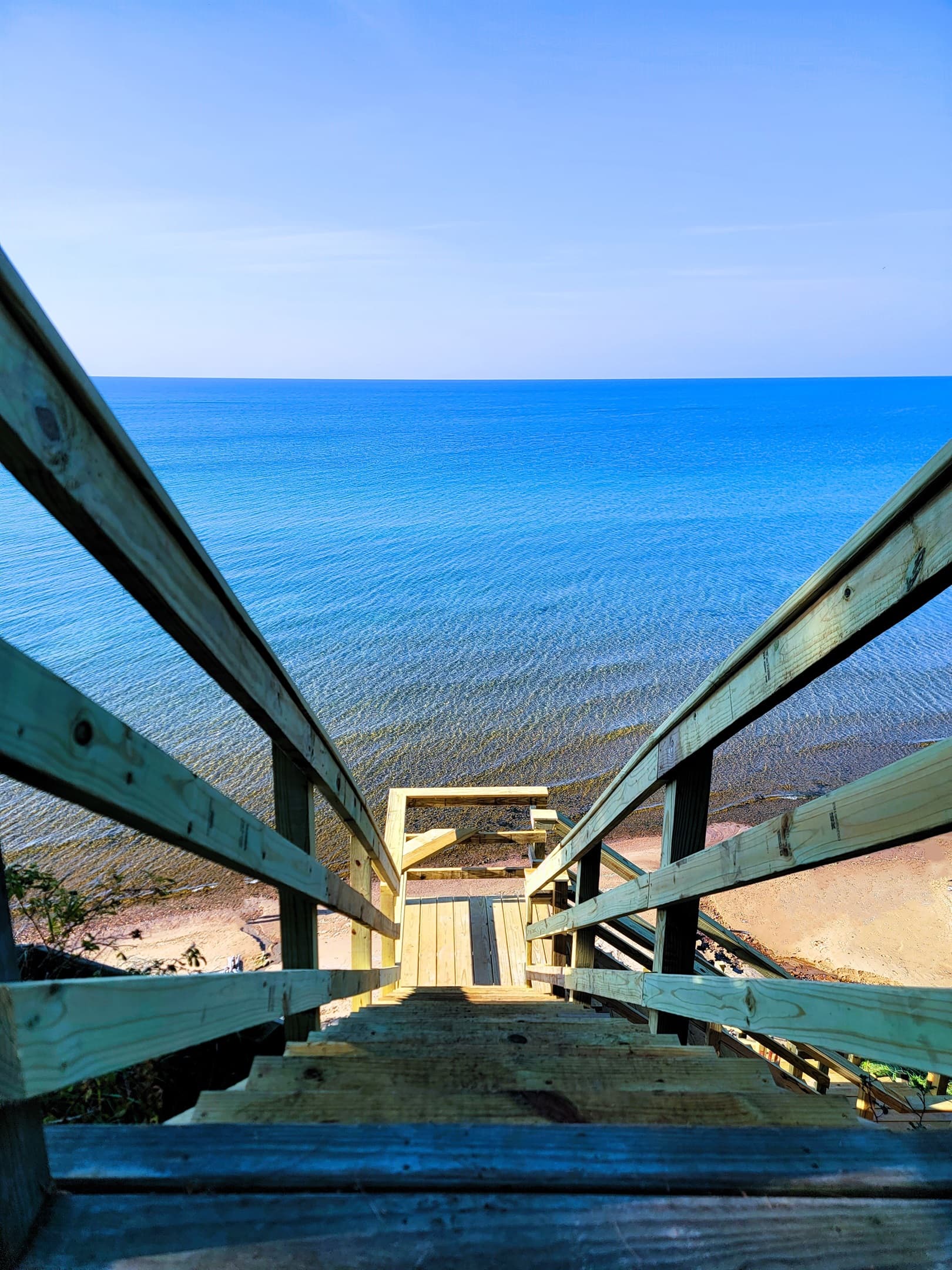 Stairs to beach include 2 locations to sit, rest, and enjoy the views