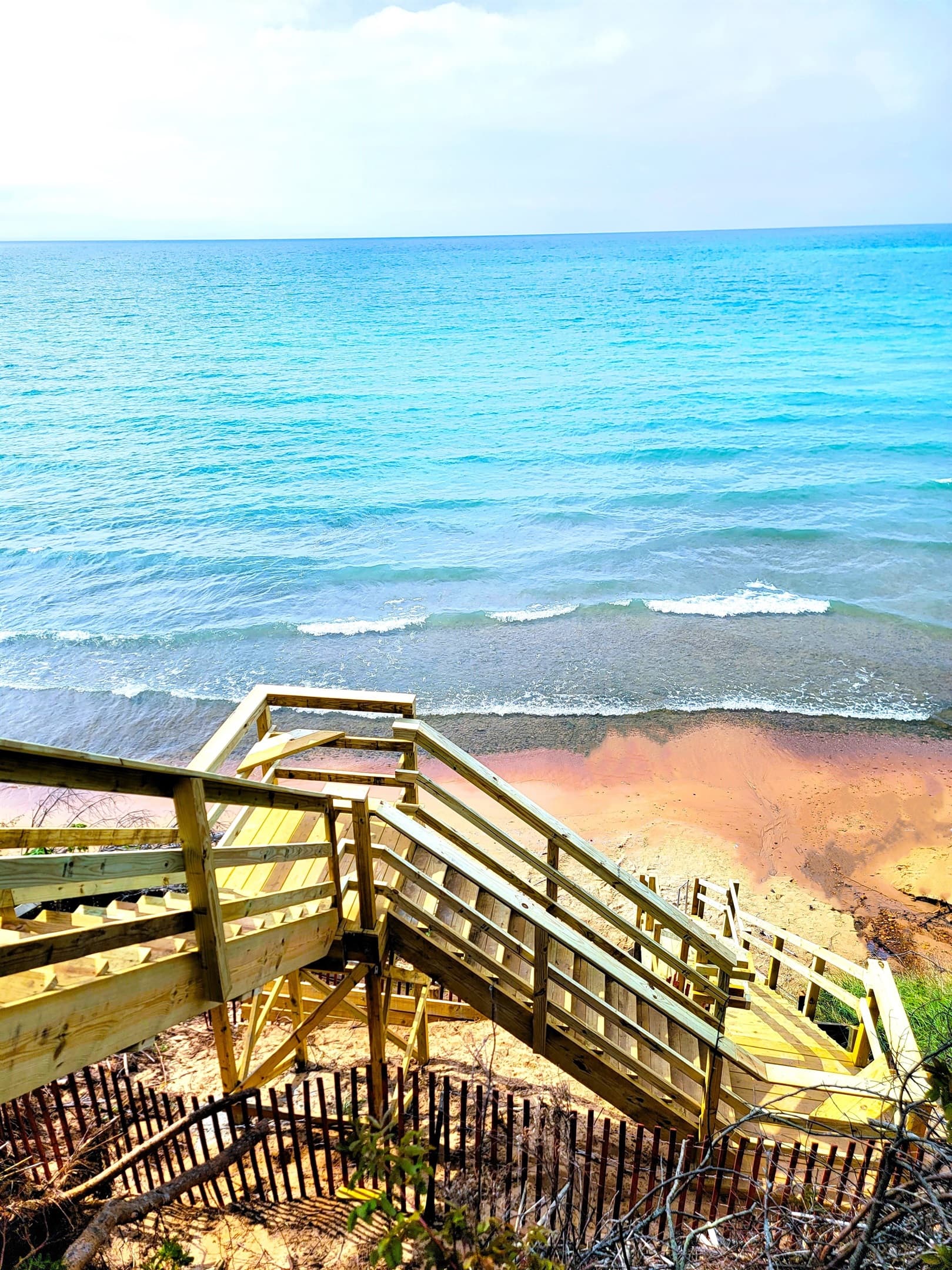 Stairs to beach include 2 locations to sit, rest, and enjoy the views