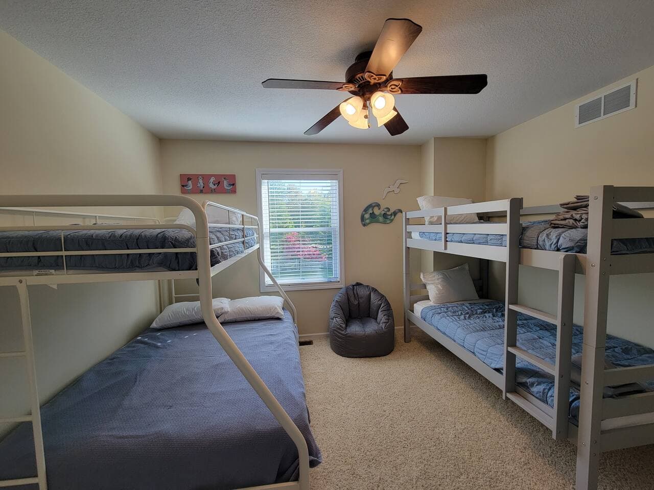 kids bunk room 1- Top bunks will have the clean bedding folded and laid on top