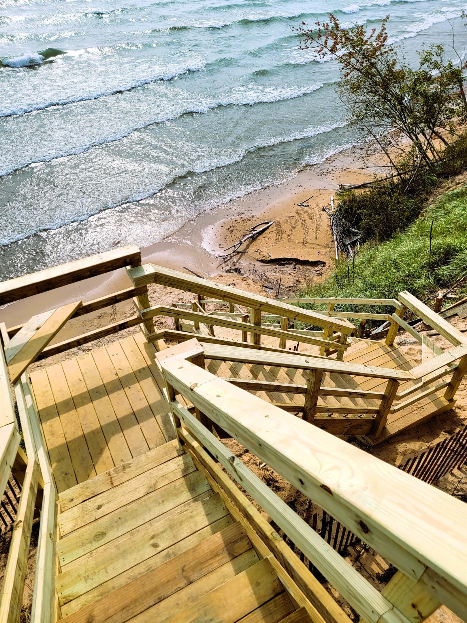 Stairs to beach include 2 locations to sit, rest, and enjoy the views