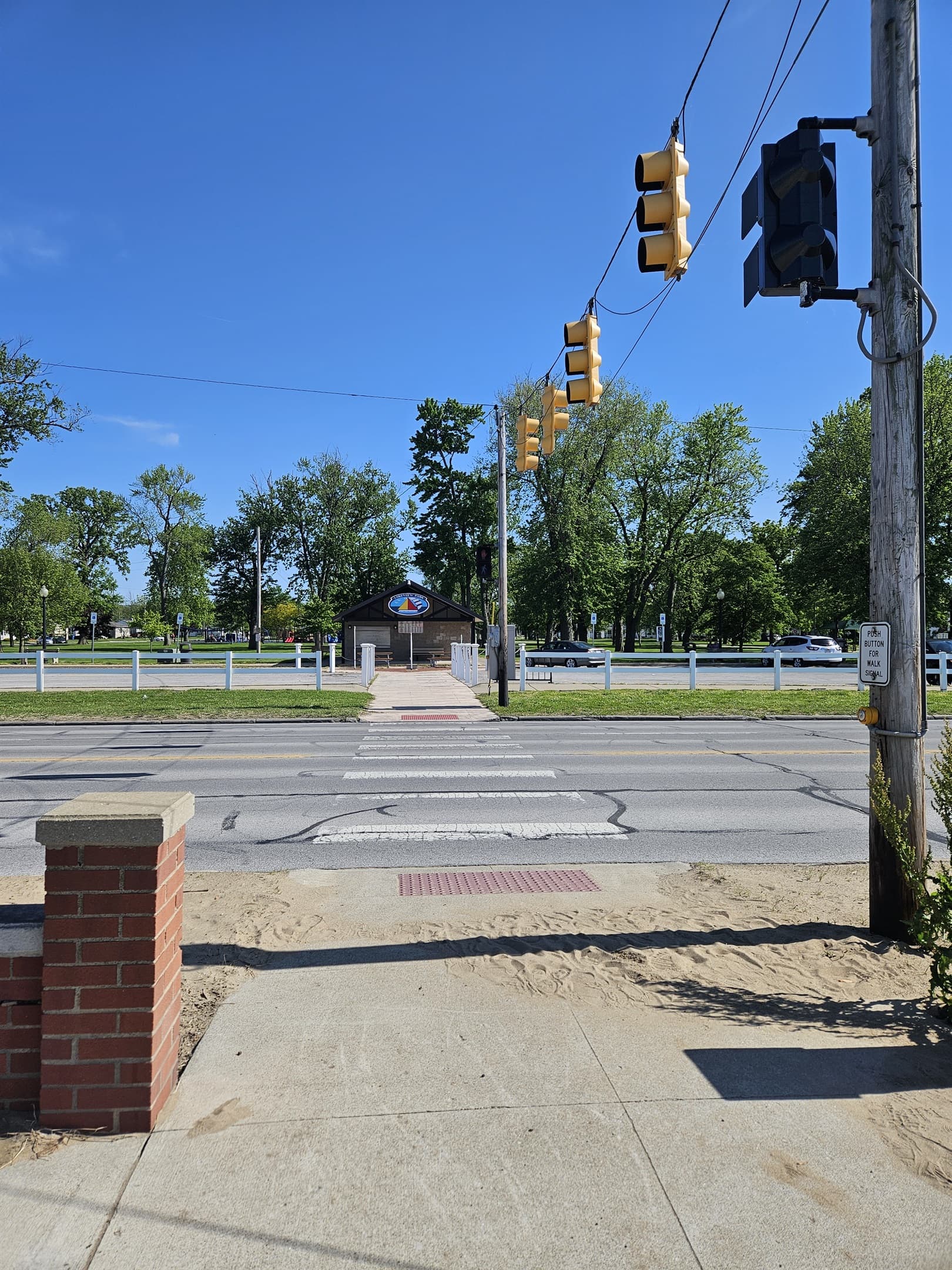 Crosswalk at the beach with traffic light to safely cross the 35mph road