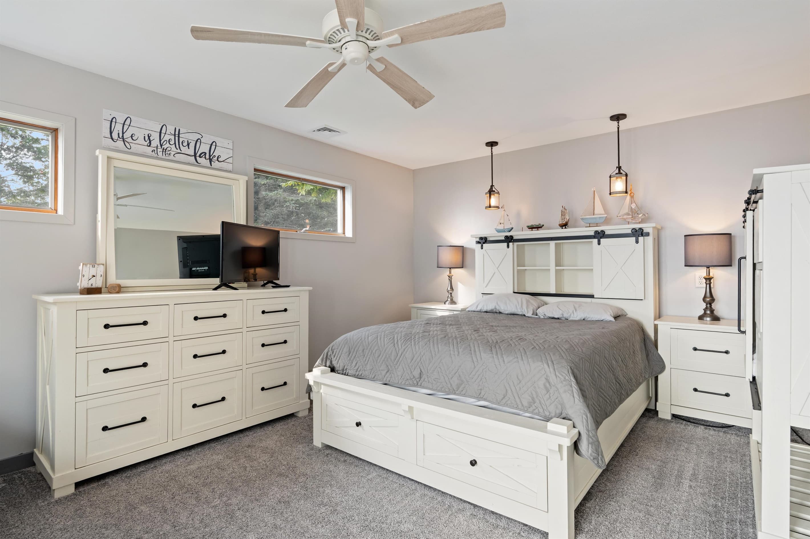 Primary bedroom with private bathroom and lake view walkout